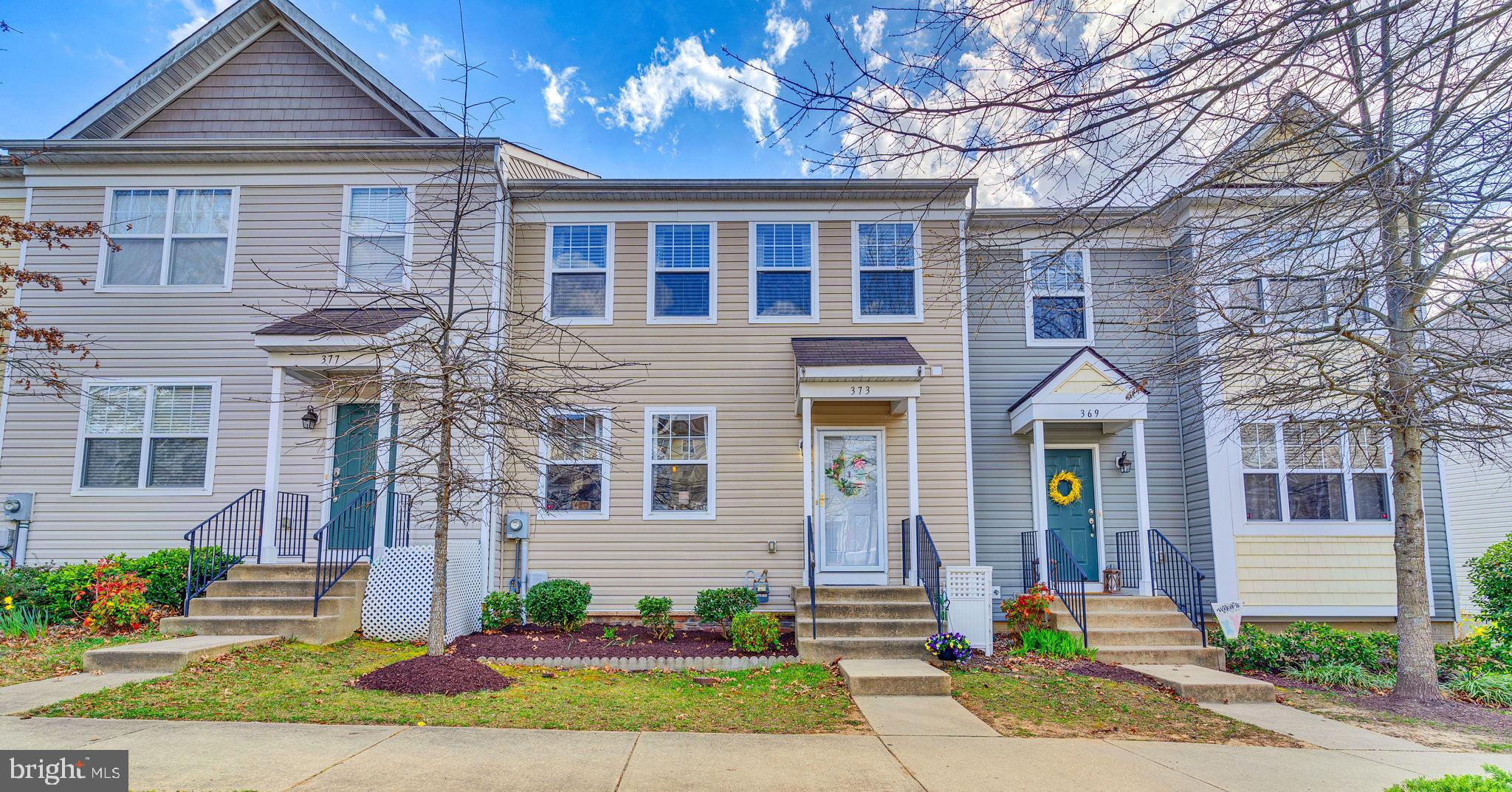 Come explore and fall in love with this three level townhouse, thoughtfully designed by the original owner with custom touches through out including extra square footage bump outs on all three levels making this model one of the largest in the community.  Main level features an open floor plan with family room open to the beautifully upgraded kitchen and dining area plus half bath and access to rear deck creating the perfect layout for both everyday living and entertaining. The upper level delivers a luxurious primary suite with the extra added space allowing for a private spa like primary bathroom, walk in closet and cathedral ceilings.  Two additional bedrooms and hall bath complete this level.  Lower level offers a generous rec room with bar area, ample storage, laundry room, third full bath  and a level walk out to a second outdoor living space ideal for gatherings or just enjoying some quiet time.  Located in the heart of town, this home is conveniently close to shops, restaurants, medical facilities and so much more.