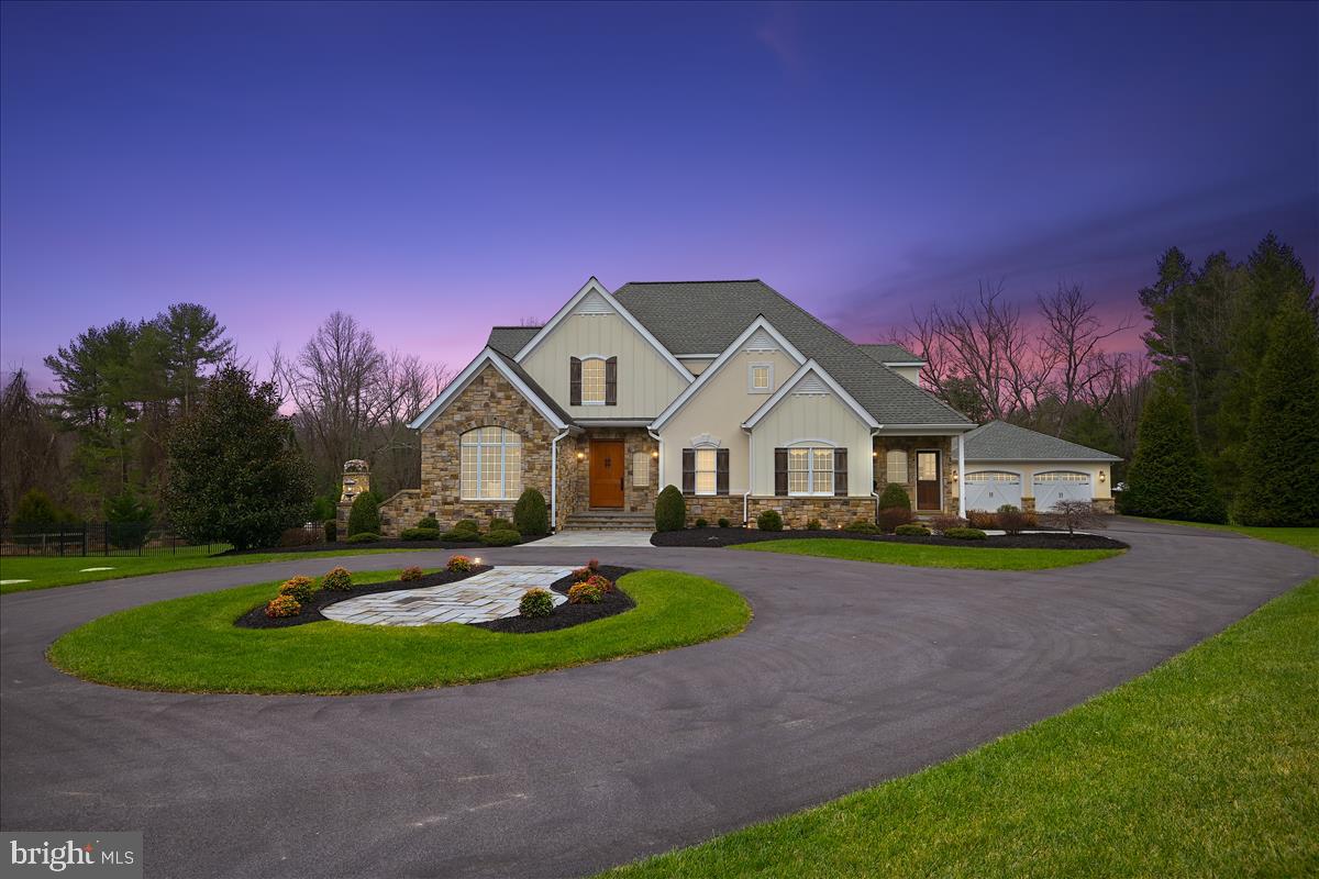 Price Adjusted.  This stunning and well-crafted home by the acclaimed GYC Group is built on 1.89 acres of land with a private entrance gate and circular drive. No expense was spared from the detail trim moldings and solid wood doors to the custom cabinetry.  This beautiful home features 5 bedrooms, 4 full baths and powder room. The lower-level area provides the 5th bedroom and full bath. Along with a theater area, full wet bar and open finished lower level leading out to the beautiful pool, the lifestyle options are endless. The private fitness area provides for a great workout and the master shower / steam combination will quicken your recovery. The music room or private office provides a restful, quiet area. The Geothermal heating and cooling system provide a comfortable and pleasant living experience. Featuring a 2-car attached garage and 2-car detached garage. The owner utilized one of the bays as her art studio which is temperature controlled with a half bath. Enjoy sunsets on the screen in porch or out by the pool.  And the opportunities continue with the adjacent 26+ acres located behind the house which is also for sale.  You will surely be impressed!