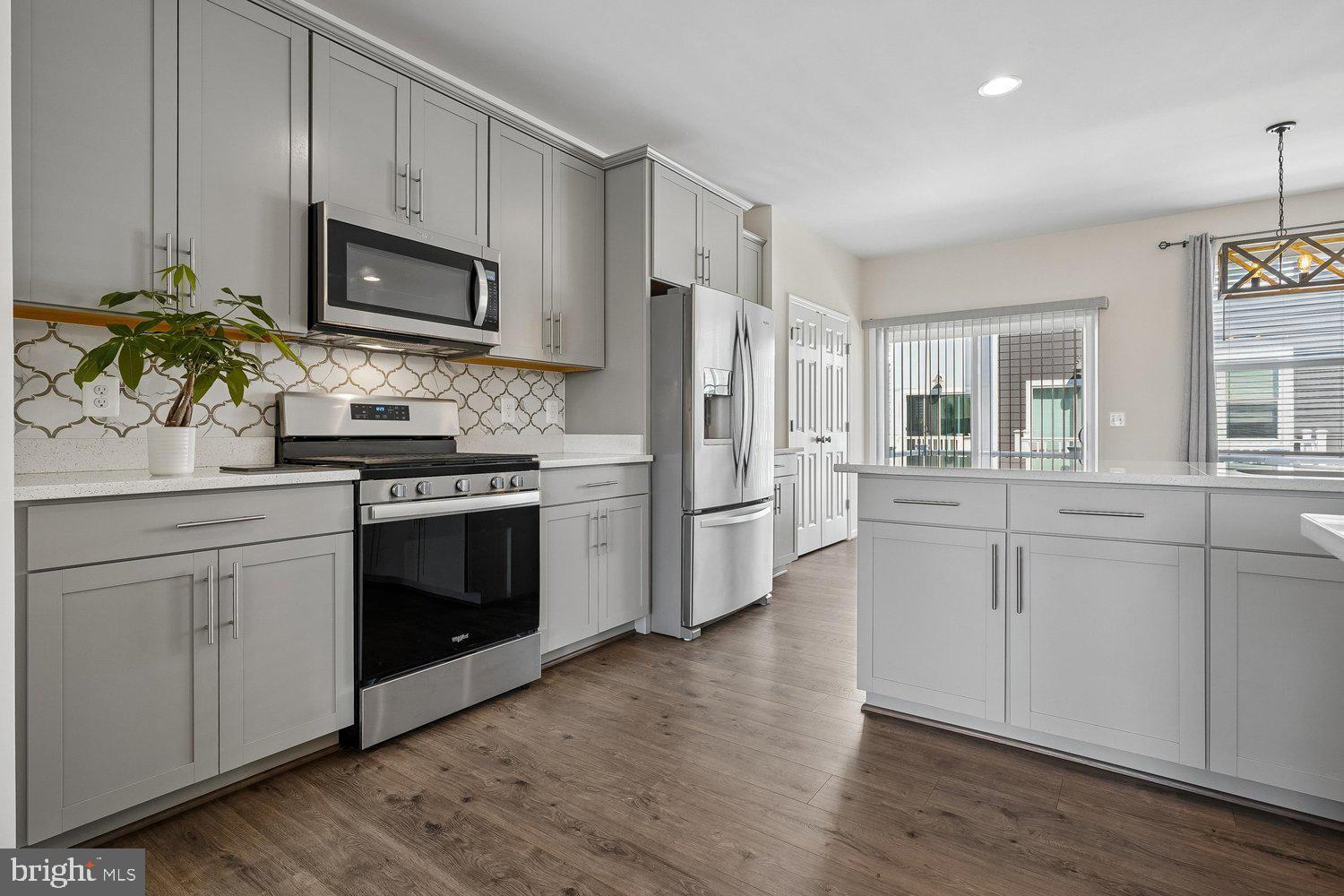 WHY WAIT FOR RATES TO DROP?! Seller is offering a 2/1 BUYDOWN to help lower your monthly PAYMENT NOW, with a potential first-year rate in the 4’s for qualified buyers. Reach out to the preferred lender for complete financing details and available programs. Welcome to a neighborhood that feels like home! Enjoy a lifestyle surrounded by endless opportunities for dining, entertainment, recreation, and commuting convenience. Located in the heart of Lorton, you’ll be minutes from historic Occoquan, scenic parks and trails, golf courses, waterfront dining, wineries, shopping destinations, performing arts venues, and some of the region’s best outdoor adventures. With easy access to I-95, Fairfax County Parkway, VRE/Amtrak, Fort Belvoir, the Pentagon, Washington, D.C., and local transit, this home offers the ideal location for both work and play.

This is a beautifully maintained, tech-enhanced 3-level brick-front townhouse nestled on a quiet private cul-de-sac in the highly desirable Liberty at Laurel Hill community. One owner, built in 2019 and freshly reconditioned in April 2026, this move-in ready home perfectly blends modern luxury, smart-home convenience, and exceptional access to everything Northern Virginia has to offer.

Inside, the open-concept main level features hardwood floors and a spacious layout connecting the living and dining areas to a stunning gourmet kitchen complete with stainless steel appliances, light gray cabinetry, custom tile backsplash, white Concerto Quartz countertops, dual pantries, and a large center island with seating and storage. Step outside onto the rear Trex deck — the perfect space for morning coffee, outdoor dining, or relaxing evenings.

Designed with modern living in mind, the home includes advanced smart-home automation and energy-efficient technology throughout. Seamlessly control lighting, entertainment, climate, locks, and video-enabled doorbells with Amazon Alexa, Google Assistant, or Apple Siri. CAT 6 wiring and a third-floor signal booster provide strong, reliable high-speed Wi-Fi throughout the home, while air quality monitoring, smart leak detection, and preset energy routines create a safe, efficient, and eco-conscious living environment.

Upstairs, the spacious primary suite offers a walk-in closet and spa-inspired en-suite bath with dual vanities, soaking tub, and tiled shower with built-in seating. Two additional bedrooms, a full hall bath, and upper-level laundry provide comfort and flexibility for guests, family, or work-from-home needs.

The lower level features a generous rec room with adjustable spot lighting, a powder room, additional storage, and access to the rear-load 2-car garage.

Combining modern design, smart technology, and unbeatable access to Northern Virginia’s shopping, dining, recreation, and commuter routes, this exceptional home offers the perfect balance of comfort, convenience, and lifestyle.