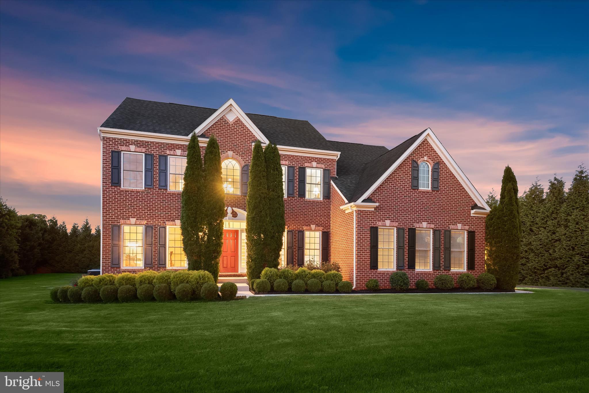 Nestled on a picturesque 1.23-acre lot in the charming community of The Warfields II, this stunning Colonial offers an exceptional blend of elegance, comfort, and timeless design. Boasting 4 spacious bedrooms, 2 full baths, and 1 half bath, this beautifully appointed residence showcases impressive architectural details, soaring ceilings, and thoughtfully designed living spaces throughout. A dramatic two-story foyer welcomes you inside, where gleaming hardwood floors and abundant natural light set the tone for the home's inviting atmosphere. The formal living room is adorned with crown molding, while the elegant dining room features crown molding, box wainscoting, and a convenient butler's pantry, creating the perfect setting for entertaining. The heart of the home is the impressive two-story family room, highlighted by soaring ceilings and a striking stone-profile fireplace. Seamlessly connected to the family room, the gourmet kitchen is designed for both everyday living and entertaining, featuring a center island, granite countertops, decorative backsplash, sleek stainless-steel appliances, pantry, and breakfast bar. The adjacent breakfast room is surrounded by light-filled windows and offers direct access to the deck, where you'll enjoy breathtaking backyard views. Additional main-level features include a private office with French doors, a convenient laundry room, and a powder room. Upstairs, retreat to the luxurious primary suite, showcasing tray ceilings, stately columns leading into a private sitting room, an expansive walk-in closet, and a private covered balcony. The spa-inspired en-suite bath features separate vanities, a soaking tub, a walk-in shower, and refined finishes, creating the perfect retreat at the end of the day. Three additional generously sized bedrooms and a full bath complete the upper level. The fully finished lower level provides exceptional additional living space, ideal for a recreation room, home theater, fitness area, game room, or whatever suits your lifestyle. Outside, the expansive 1.23-acre setting offers a deck, a two-car attached garage, a private lot surrounded by mature trees, and endless opportunities for recreation, entertaining, and enjoying the beauty of the surrounding landscape. Recent updates include upper and lower-level paint, deck, water heater, water treatment system, upper-level carpet, and more! Combining elegant living spaces, thoughtful updates, and a desirable location, this remarkable home offers the perfect balance of luxury, comfort, and functionality. Welcome home.