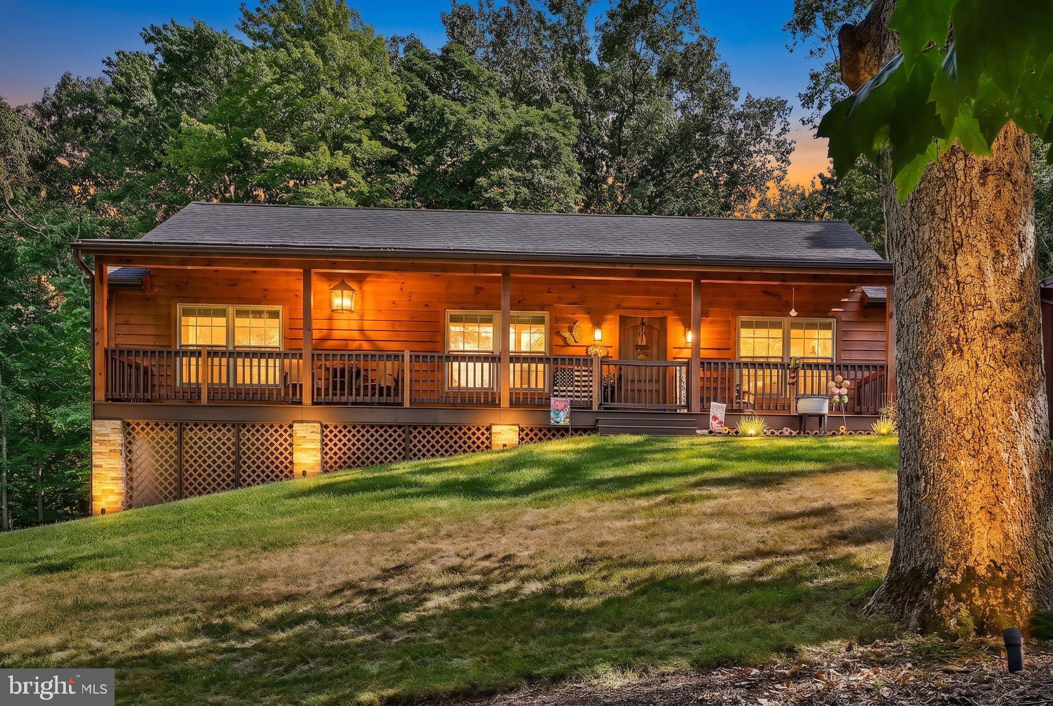 Charming meets modern in this beautifully crafted 2-bedroom cottage-style home located in the gated community of Lake Wynonah. Built in 2018, this move-in-ready home offers thoughtfully designed living space with warm, inviting finishes throughout.
The open-concept living area features soaring vaulted pine ceilings that create a bright yet cozy atmosphere. The kitchen is the heart of the home, showcasing stunning hickory cabinetry with soft-close doors and drawers, an island with extra seating, granite countertops, and a spacious walk-in pantry that provides exceptional storage. 
The roomy primary suite offers a peaceful retreat with a private ensuite bath, as well as his and hers closets.  The partially finished lower level expands your living space with a custom bar, pool table area, and plenty of room for entertaining, hobbies, or relaxing with family and friends. It has also been prepped for a pellet stove with corresponding hearth. Situated on a quiet, beautifully maintained ¾-acre lot, you'll enjoy privacy and nature from either your front or rear deck, or sitting around the fire pit.  The home also features a matching 2-car detached garage. 
If you've been searching for a newer home with quality craftsmanship, cottage charm, and resort-style amenities, this is one you won't want to miss! Please see the LWBOD Dam Slide  Presentation for further information regarding the Lake Wynonah dam rehabilitation project. Please call the Lake Wynonah office for further updates. Lake Wynonah is a gated community featuring 2 freshwater lakes (at capacity, Lake Wynonah is approximately 90 ft. deep and Fawn Lake 45 ft. deep at deepest areas).