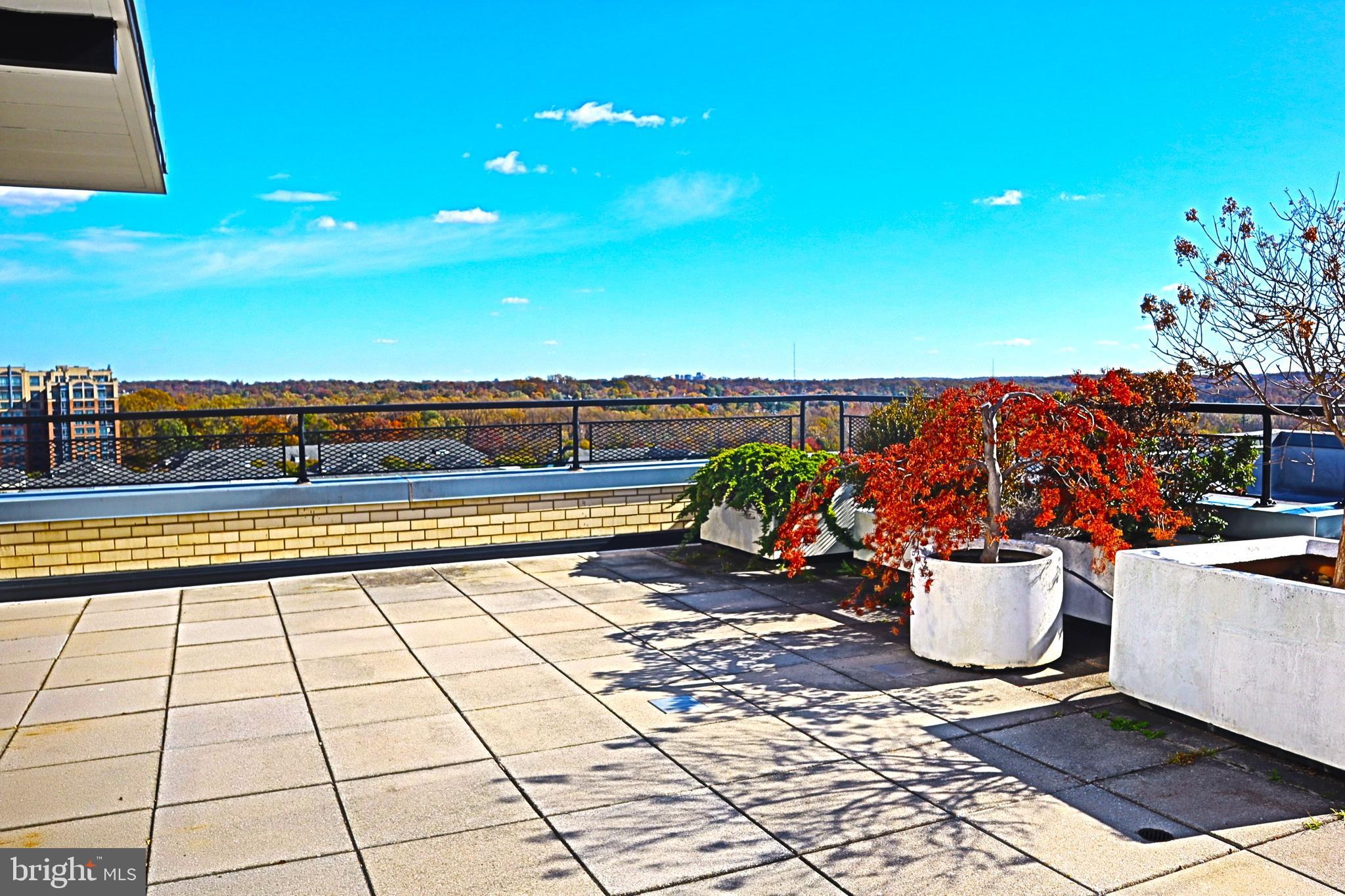 BEST VALUE in North Bethesda! Seller will prepay 6 months of condo fees for buyer at closing! This apartment home shows beautifully, does need some updating and is priced accordingly. Sold AS IS. New windows and sliding glass doors to be installed soon, no increase in fees, no special assessment. Grosvenor Park III is an elegant high amenity building offering only 5 penthouse apartment homes, each of which is an extraordinary residence and rarely offered for sale.  Large and lovely this penthouse apartment home is ideal for those seeking the peace of mind and security of apartment living but still want the option of grand scale entertaining. Floorplan is ideal for easy entertaining, inside and out. Host holiday dinners for family and friends. Easily accommodate guests at parties. Spread out with plenty of communal space of seek solitude in the many private spaces, both options are yours, here. This light filled penthouse apartment home boasts 3 bedrooms (all with ensuite baths) 3 full and 2 half baths, formal living room with 10 foot ceilings and decorative fireplace, formal dining room, gourmet eat in kitchen with pantry (gas cooktop), lovely foyer to greet guests, gallery, library, IN UNIT LAUNDRY ROOM, and extraordinary outdoor living space. The king sized primary suite features two massive walk in closets, a sitting area, and ensuite with two large vanities and custom shower enclosure.  Custom built-ins throughout. Lovely finishes, millwork and furniture quality cabinetry. Live happily ever after as it is, add a few personal touches, or bring your architect and create the finest residence in the area, with the size and scale of this home, your options are endless. Extremely rare and featured here is an outdoor living space like no other. This penthouse features a massive terrace with screened enclosure overlooking Bethesda and Washington DC. Adorned with planters featuring mature specimen plantings and space galore. Panoramic views abound, it is absolutely stunning and provides a lifestyle like no other. Life on the 17th floor is quiet, serene and exclusive. Two premium deeded garage parking spaces included. Grosvenor Park III offers a wealth of amenities including 24/7 security, professional on site management, outdoor pool, tennis, fitness center, lake, scenic walking paths, on site dry cleaning, award winning on site market, and more. Excellent location, just a quick walk to Grosvenor Metro, minutes to 355/495/270, downtown Bethesda, Washington, Blue Ribbon schools, shopping, dining, entertainment and everywhere you want to be. Truly a once in a lifetime offering. No pets. No smoking.
