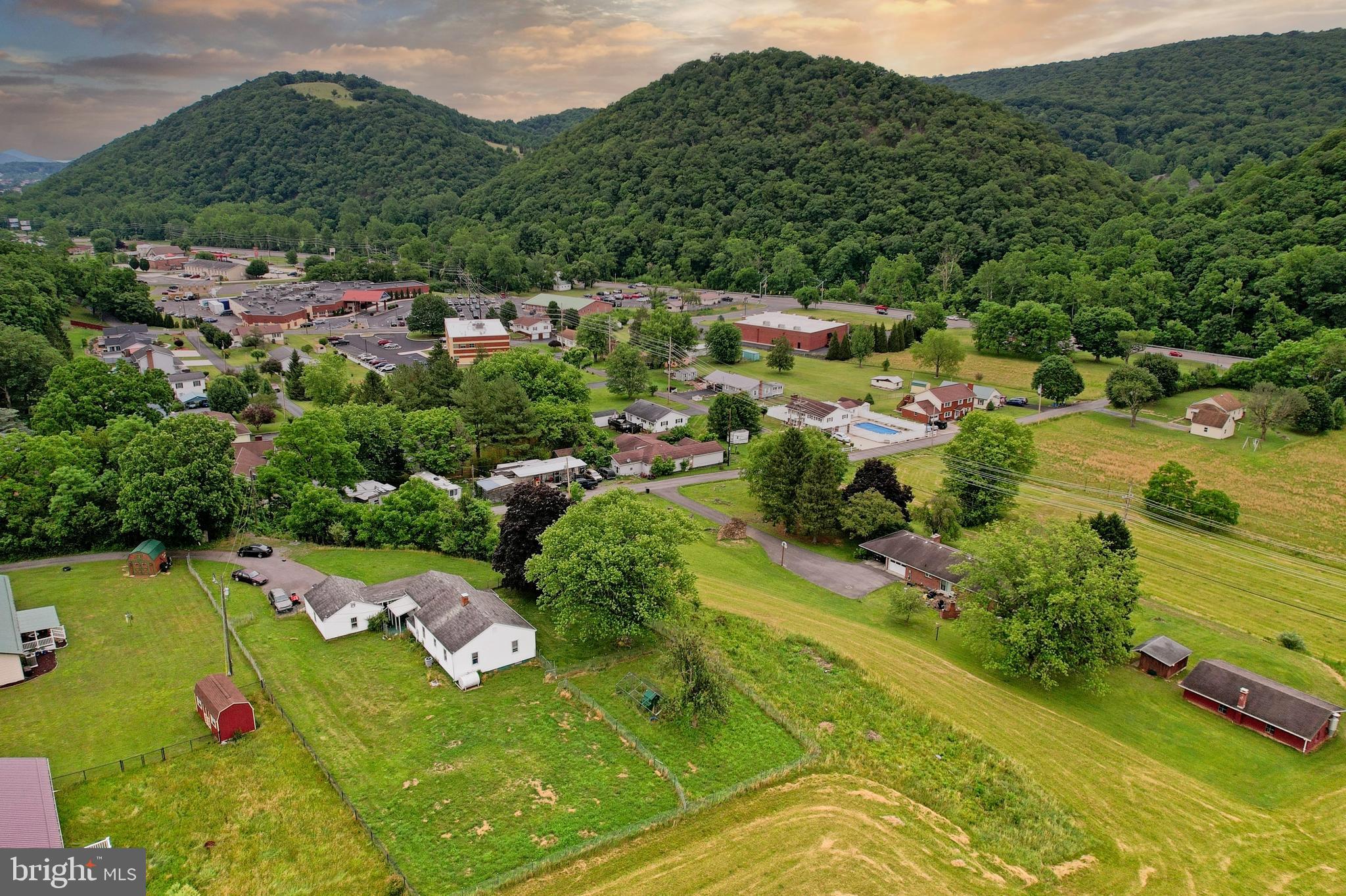 Enjoy the perfect blend of country charm and convenience in this cozy  3-bedroom, 1-bath ranch home. Nestled outside the city limits, this property offers beautiful mountain views and a peaceful setting while remaining just minutes from shopping, dining, and everyday amenities. Inside, you'll find hardwood floors that add warmth and character throughout the home. Relax on the covered front porch and take in the scenic surroundings, or enjoy the privacy of the fenced yard—ideal for pets, play, or outdoor entertaining. A detached garage provides additional storage and workspace. Whether you're looking for your first home, downsizing, or seeking a quiet retreat, this property offers comfort, convenience, and picturesque views in a desirable location.
The full basement offers excellent storage and endless potential, with plenty of room to be finished into additional living space, a recreation room, home office, workout area, or whatever best suits your needs. Whether you're looking for your first home, downsizing, or seeking a quiet retreat, this property offers comfort, convenience, and picturesque views in a desirable location.