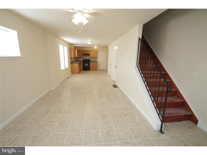 West Philly home available for RENT! Be the first to rent this brand new rehabbed home which is completely new inside and out! From outside there is a brand new porch area in the front, and a 2 car garage and roof deck in the rear. Inside, the first floor features an open layout and a powder room for convenience, with a oak kitchen and new stove.  Upstairs the home includes 3 nice sized rooms with plenty of closet space and a tiled bath.  The home features all new mechanicals and Central Air, and not to mention it is cable and phone ready! This property is one of many managed by a professional management company in the area.  Applications can be obtained on Management company website, call agent for details.
