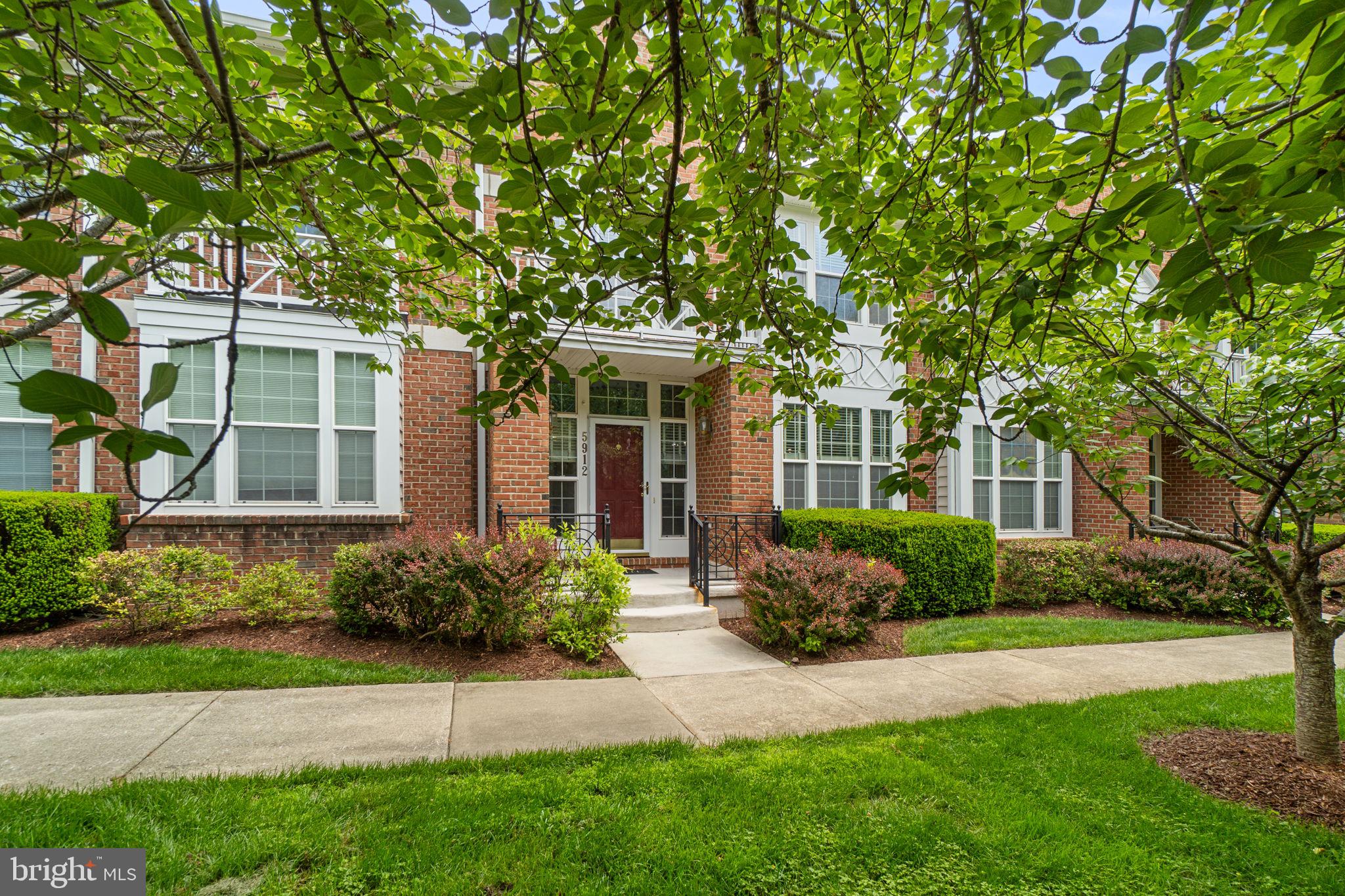 Elegant Colonial-style townhouse nestled in desirable Summerfield at River Hill, offering 3 bedrooms, 3.5 bathrooms (updated in 2023), and 2,986 square feet of beautifully maintained living space. // Hardwood floors flow throughout the spacious main level, beginning in the welcoming foyer featuring a coat closet and convenient powder room. The home immediately opens into a sun-filled living room enhanced by two ceiling fans and abundant natural light. The adjoining dining room, accented by a statement chandelier, flows seamlessly into the kitchen, creating an ideal open-concept layout for everyday living and entertaining. // The eat-in kitchen is thoughtfully appointed with stainless steel appliances (2024), granite countertops, custom tile backsplash, a pantry, ample cabinetry, a breakfast bar, and updated light fixtures, blending style and functionality with ease. // Upstairs, hardwood flooring continues throughout three generously sized bedrooms. The primary suite features a tray ceiling, two walk-in closets, a private sitting room, and a spa-inspired ensuite bath with a dual-sink vanity. Two additional bedrooms feature soaring vaulted ceilings and share an additional full bathroom, while a conveniently located laundry closet includes a washer and dryer updated in 2024. // The fully finished lower level offers an expansive recreation room ideal for entertaining, lounging, movie nights, fitness, or flexible everyday living, along with a full bathroom and an unfinished area ideal for storage or future expansion possibilities. // Additional highlights include an attached one-car garage, driveway parking, and valuable recent system updates, including a roof replacement (2026), water heater replacement (2026), and HVAC servicing (2026), providing added peace of mind.  // Select images have been virtually staged for illustrative purposes.