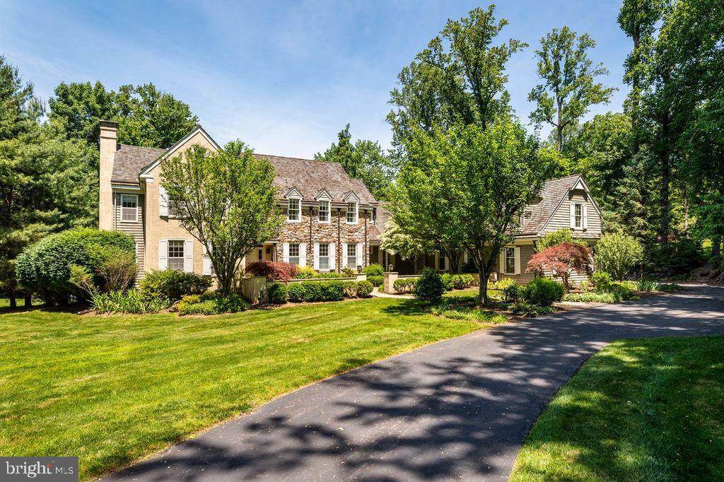 Situated on approximately 1.3 stunning acres in the sought after Leopard Farm of Berwyn, 1285 Farm
Road is an exceptional Pohlig-built estate home that seamlessly blends timeless craftsmanship, elegant
design, and gracious living. Set back from the road and surrounded by mature landscaping, specimen
gardens, and towering trees, this distinguished residence offers the privacy of a country retreat while
remaining minutes from the Main Line's finest schools, shopping, dining, and transportation.
Built in 1989 by one of the region's most respected custom builders, the home encompasses
approximately 6,103 square feet of beautifully appointed living space featuring 5/6 bedrooms, four full
baths, and two powder rooms. The inviting center hall welcomes guests into sophisticated formal living
room, dining room and library with beautifully designed staircase to the second level. The heart of the
home is the kitchen with an oversized island, walk-in pantry, and breakfast area that opens seamlessly to
a spacious family room designed for everyday living and effortless entertaining.
Architectural details throughout include hardwood floors, custom millwork, exposed beams, vaulted
ceilings, skylights, built-ins, dual staircases, and two fireplaces, creating warmth and character at every
turn. The thoughtfully designed floor plan also includes a private home office, bonus spaces, and a
beautifully finished walkout lower level complete with additional bedroom or office, full bath, entertainment
area with bar, and additional living/recreational areas.
The expansive second level includes primary suite which serves as a private sanctuary with generous
walk-in closets and a spa-inspired bath. Four additional bedrooms are spacious and well-appointed,
offering flexibility for family, guests, or multigenerational living.
Outdoor amenities abound! A spacious deck off the kitchen overlooks the property's stunning in-ground
pool, surrounded by lush gardens and mature landscaping that provide exceptional beauty throughout
every season. The grounds have been meticulously curated to create a serene and picturesque setting
for relaxation and ease of entertaining.
The three car garage, connected to the main home by garden walkway, offers the best possible scenario
for creating a full home office or guest house. This is very special and awaits the perfect design.
Located within the award-winning Tredyffrin-Easttown School District and served by Conestoga High
School, this remarkable property offers a rare opportunity to own a signature Main Line residence in one
of Berwyn's most sought-after neighborhoods. Combining privacy, elegance, and convenience, 1285
Farm Road represents Main Line living at its finest.