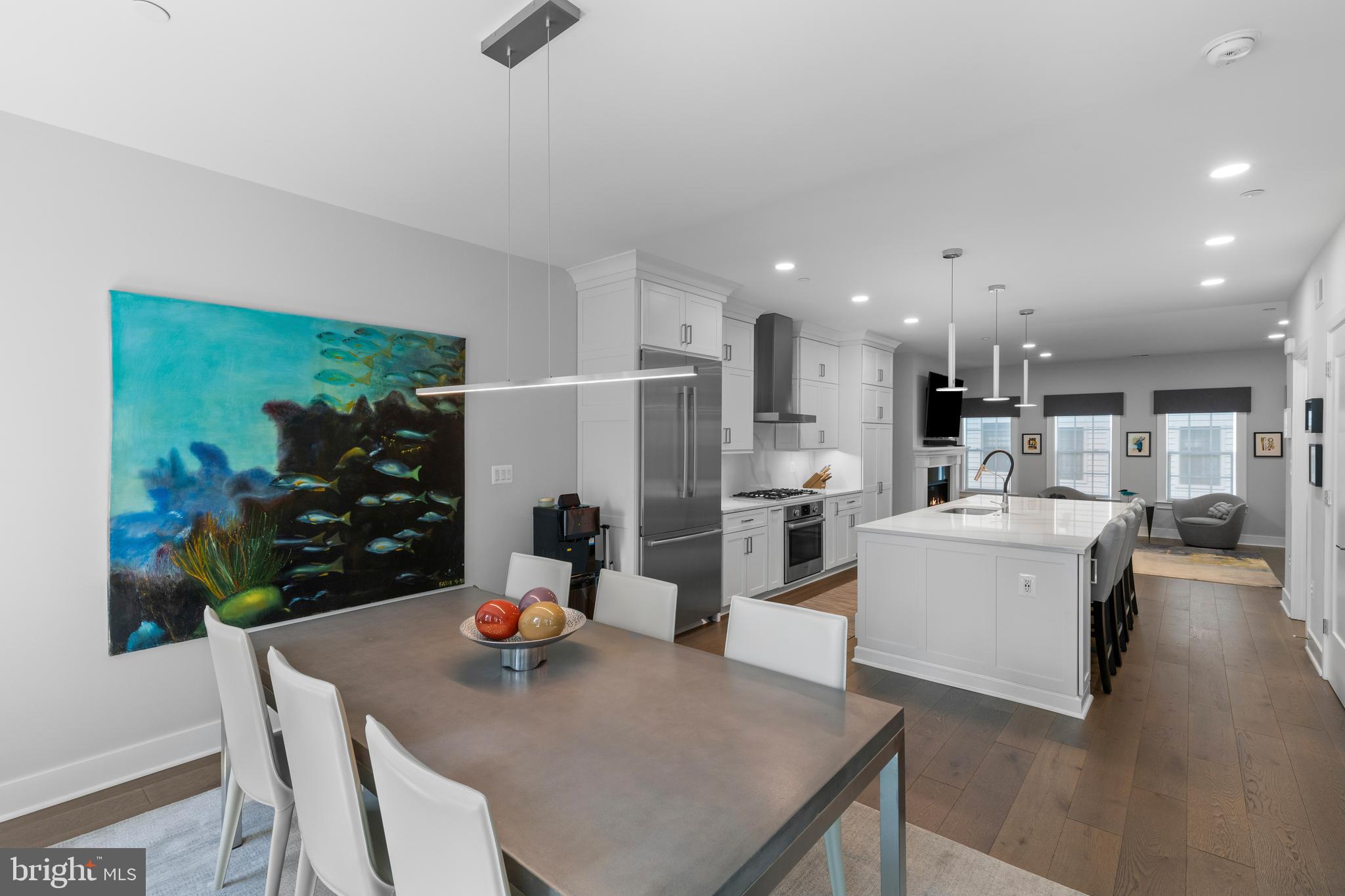 Enjoy urban living at 285 West Street #15! This stunning property offers a stylish way to embrace the best of downtown Annapolis in a modern townhome with an elevator and rooftop deck. Step outside and enjoy the city’s energy—shops, restaurants, the waterfront, and cultural attractions are all just a short stroll away—while still savoring the comfort of a private, lock-and-leave retreat.

Built by Bozzuto in 2020, this four-bedroom, four-and-a-half-bath home features an open, light-filled layout designed for both everyday living and entertaining. The open floor plan on the main level includes the living room with spacious seating area and fireplace, a dining area, and a classic all white gourmet kitchen anchored by an island with ample seating, high-end appliances, and a built-in sideboard with beverage center. Upstairs, the primary suite offers two walk-in closets and a spa-like bath with double vanities, and a large tiled shower. An additional bedrooms with ensuite bath and conveniently located laundry room complete the this level.  Head upstairs to the top floor via the stairs or elevator to enjoy the inviting family room, guest bedroom and enviable rooftop deck with double sided fireplace and sunshade, an incredible retreat for relaxing and entertaining on a beautiful evening.

The entry level provides a flexible bedroom or office with full bath and boasts heated floors for added comfort.  Rounding out the appeal is a two-car garage, plenty of storage and a plethora of upgrades and curated finishes throughout.

Perfectly located within close proximity of everything Annapolis has to offer; walk to the shops and restaurants of West and Main Streets as well as the Historic District, City Dock and the Naval Academy. Traveling or commuting is just as convenient by easily accessing Rt. 50 and 97 which provides direct access to Baltimore, BWI, Ft. Meade/NSA and Washington, DC., or head over the Bay Bridge to the Eastern Shore for a quick beach vacation. Welcome Home!