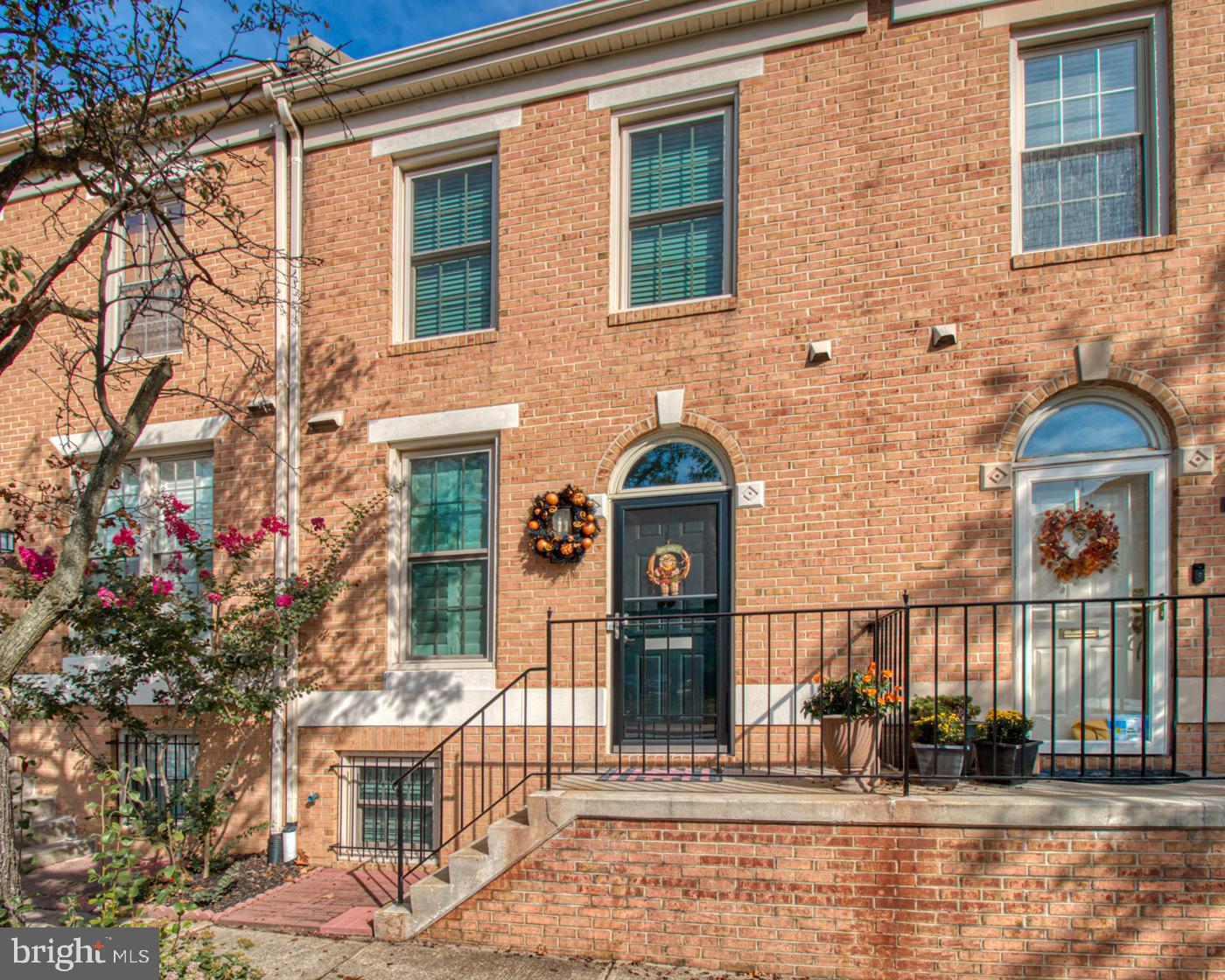 Canton lifestyle at its best in this well appointed and renovated townhome located across from Canton Waterfront Park.  Wonderful location to enjoy all that the Canton area has to offer.  Upon entry, you are greeted with a foyer that leads to the bright and tastefully renovated kitchen.  Functionality at its best, this renovated kitchen features new stainless steel appliances, quartz counters, subway tile backsplash, shaker cabinets, and pass through to the dining room with serving bar for easy entertaining.  The open concept living/dining room features a wood burning fireplace, powder room, and solid surface floors that lead to the perfect al-fresco dining area on the deck.  Fully fenced and spacious, the exterior space is perfect for all types of lifestyles.  The second level features new carpeting, two bedrooms both with ample closet space, hall skylight with vaulted ceilings, and a renovated full bathroom with tiled shower surround and a pleasing aesthetic for a spa-like feeling.  The finished basement has endless possibilities and features a full bathroom, new carpeting, and a wood burning fireplace.  The basement rounds out with laundry room and additional storage space.  The entire home was recently painted with Repose Gray to accommodate many color palettes.  All of these features plus recently replaced windows, water heater, and HVAC make this home move-in ready.  The property has one dedicated parking spot on the secluded alley at the rear of the property.  All of this on a tree lined street with plenty of street parking.   Walk to Canton Waterfront Park, restaurants, and nightlife. Easy commuter access to 95, 695, 895.