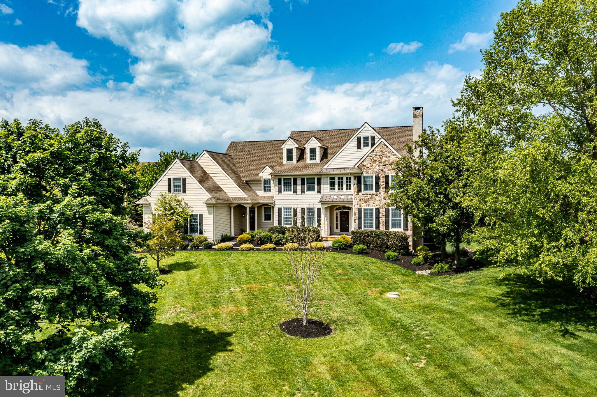Nestled in the prestigious Newlin Greene community and located within the highly acclaimed Unionville-Chadds Ford School District, this exceptional 7-bedroom, 6-bath home offers luxury, flexibility, and privacy on a premium  homesite.

From the moment you arrive, the home’s HardiePlank and stone exterior, professional landscaping, and picturesque setting create an impressive first impression. Inside, expansive living spaces, 9-foot ceilings, crown molding, and hardwood floors combine to create a warm yet sophisticated atmosphere throughout the main level.

The grand foyer is flanked by a formal living room with gas fireplace and an elegant dining room. At the center of the home is a chef’s kitchen featuring custom soft-close cabinetry, granite countertops, a professional-grade 6-burner Dacor range with hood, Sub-Zero refrigerator, farmhouse sink, oversized island with seating, and a spacious pantry with additional refrigerator storage. The adjoining breakfast area opens seamlessly into the family room, highlighted by a dramatic stone wood-burning fireplace.

A private first-floor bedroom suite with full bath — currently being used as a home office — offers exceptional flexibility for guests, an au-pair, in-laws, or a dedicated workspace. The mudroom includes custom built-ins and functional everyday storage.

Upstairs, the luxurious primary suite features vaulted ceilings, a private sitting room, dual walk-in closets, and a spacious bath with separate vanities, walk-in shower, and jacuzzi tub. Four additional oversized bedrooms provide ample room for bedrooms, study areas, or play spaces. The second floor also includes three additional full baths, a large laundry room with sink, and a rear staircase for added convenience.

The unfinished third floor offers incredible future potential for additional living space, whether used as a playroom, media room, gym, or additional bedroom suite.

The finished lower level was designed for entertaining and lifestyle. Highlights include a glass-enclosed gym, full bathroom, expansive recreation area with custom built-ins, and an impressive stone bar complete with sink, microwave, keg fridge, wine fridge, integrated sound system, display storage for over 100 bottles of wine, and built-in lighting.

Outside, the custom rear patio and fire pit create a private outdoor retreat surrounded by mature landscaping and rolling Chester County scenery. The grounds also feature pear trees and beautifully maintained front landscaping that complements the home’s luxury appeal.

Improvements over the last 5 years include, new roof, new hvac units, garage cabinetry and floor epoxy and new carpets upstairs.

Come and see  timeless look and finishes of your next home.   

Conveniently located near West Chester Borough, Longwood Gardens, Philadelphia, and Delaware commuting routes, this home combines elegance, comfort, and functionality in one exceptional offering.

Floor plans and dimensions are approximate and not guaranteed.