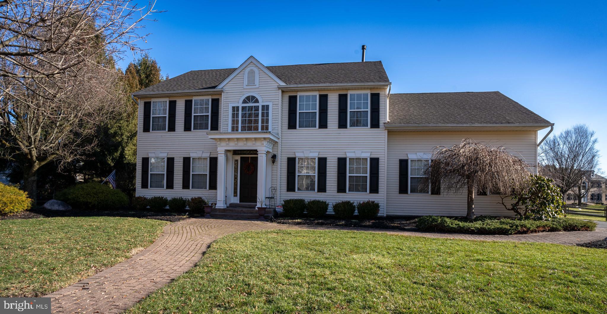 Welcome to this thoughtfully updated Colonial in the Penns Field neighborhood. Situated at an angle on a corner lot, this home is one of a kind.  Step inside through the grand two-story foyer with hardwood floors surrounding you. To your left is the formal living room, currently used as a home office. To the right, a beautiful formal dining room which leads down the hall to the half bath, first floor laundry room, and garage. Beyond that is an updated kitchen complete with stainless appliances, granite countertops and beautiful custom cabinetry with pull-out pantry shelves, under cabinet lighting and storage galore that any cook dreams of. Enjoy the open layout while you prep your favorite meal and keep an eye on your family or guests in the eat-in kitchen and family room with wood burning fireplace- all within view. Beautiful hardwood floors throughout the first level. Off the family room head down to the ultimate finished basement. Great for a hangout space, game night, "man cave", home gym or office...the possibilities are endless! Back up to the 2nd floor you'll find a massive primary suite with a bonus sitting room (currently home office), 2 walk-in closets, and en suite bath. Three additional bedrooms and full bath complete the upstairs. The backyard has a lovely brick patio, beautiful gardens, storage shed and a giant fenced in area. A prime location for easy commuting to major cities and highways, yet in the bucolic setting of Bucks County with its rich history and unique small town feel of nearby Yardley, Newtown, and so much more. This home is not to be missed!
