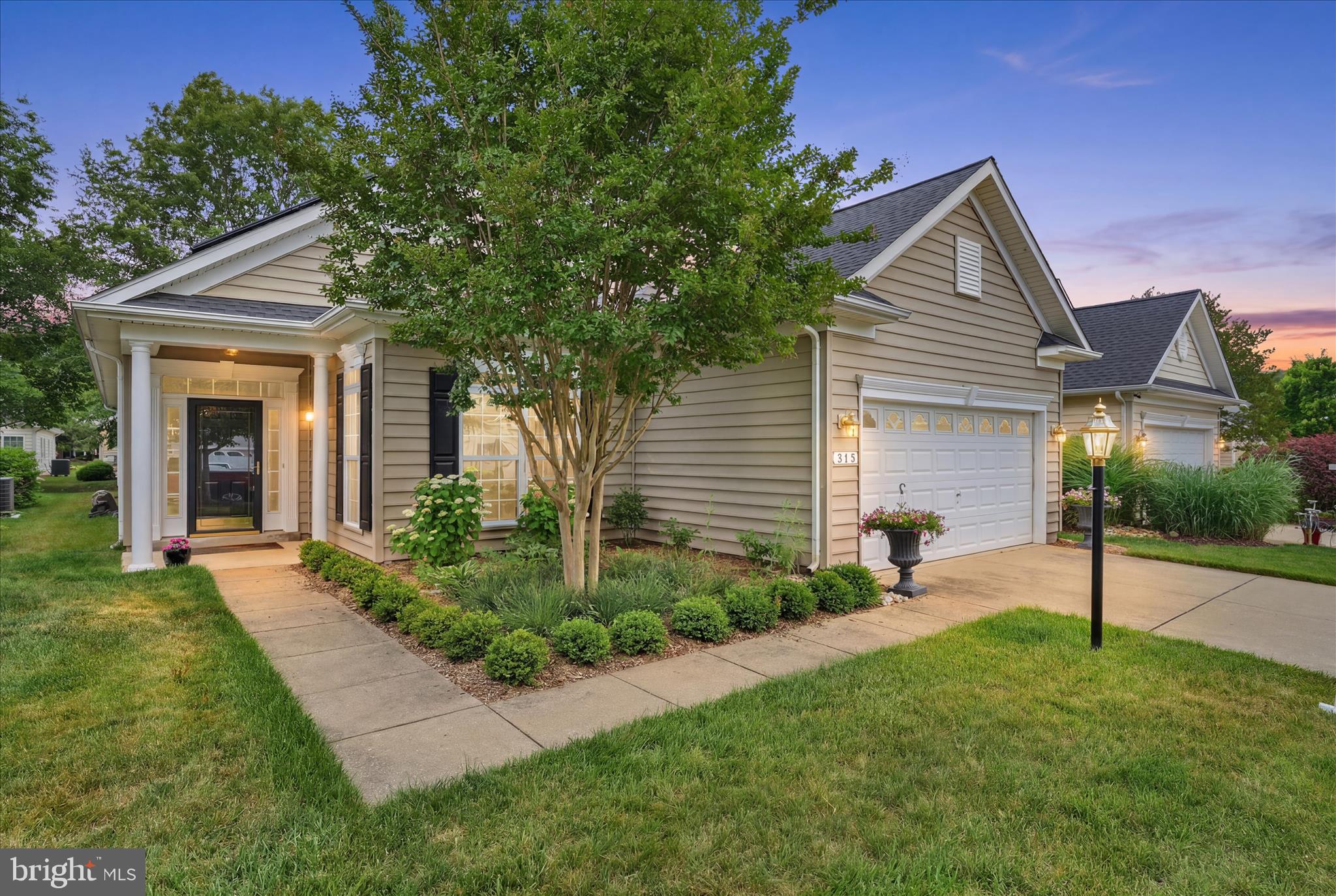 HUGE PRICE IMPROVEMENT!
This bright, custom Vivaldi model in Centreville's premier Symphony Village community perfectly balances luxury and comfort. Featuring gleaming hardwood floors throughout, it offers an updated kitchen with premium appliances, plus stunning professionally landscaped yards and a fabulous patio ideal for outdoor entertaining. Model: The highly sought-after Vivaldi floor plan, known for its spacious and functional 3-bedroom, 2-bathroom layout . Owners addition of a private formal area really creates a wonderful flow with 10 ft. ceilings! Flooring: Warm, continuous hardwood floors that flow seamlessly from room to room, creating a cohesive and elegant feel. The Kitchen: Beautifully updated with ample counter space for meal prep, plus brand-new modern appliances to make cooking a breeze. Outdoor Oasis: Professionally landscaped front and back yards that provide excellent curb appeal and privacy. Step out onto the fabulous paver patio—the perfect setting for morning coffee or evening dining. 
The Symphony Village community is well established, with mature trees throughout, and an impressive clubhouse with many amenities, including a concert hall for the many events organized by the various committees. The main gathering area is bright and welcoming, and is the location for semi-monthly social hours where you bring a dish to share and get to meet your neighbors. Several groups with varied interests meet in the clubhouse on a regular basis, and you might walk through the clubhouse and see folks learning to paint in the craft room, others playing pool, some playing mahjong in the concert hall, or committee meetings to keep things humming along. You can walk outside to the covered patio area and the pool beyond, where residents enjoy holiday picnics, quiet evening time, and fun with the kids during the day. The indoor pool is open every day from early morning until late at night, and you can show up for water aerobics every weekday morning at 9:00A.M. Currently there are Spanish classes offered, in addition to soul line dancing, and at any time you can learn how to play bridge or hand and foot, so there is plenty to keep everyone busy. However, there is no requirement to participate in any activities, and you can live a quiet life in Symphony Village enjoying retirement or still working. There are many areas to walk in around the neighborhood, and in the clubhouse grounds is a pergola to sit and  watch the world go by, a kids' playground, a picnic area, bocce, a putting green (and active league) and a trail leading to Dunkin' Donuts and the shopping center just minutes away.