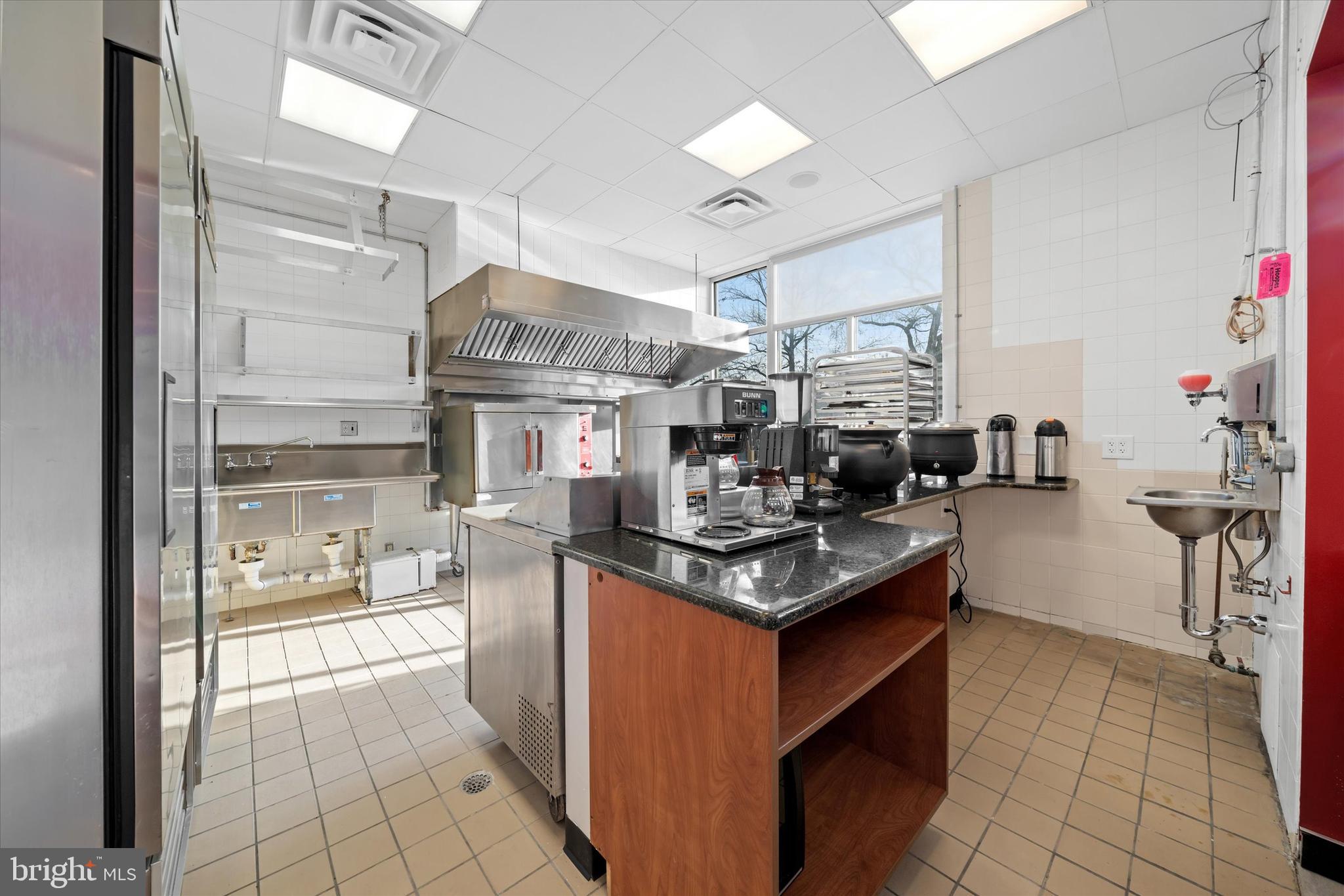 Imagine running your own cafe,  located in one of Wilmington's most sought after locations at The Devon on Pennsylvania Ave. Welcome to  The Devon, a dominant property located in town and close to Greenville, a visibly convenient location!  Situated on the first floor, unit 103 is a fully fit out café complete with hood, ansul system, refrigeration, triple sink, work space, even the tables/chairs. And there are hundreds of residents in the building that desire the very thing that you can deliver!  Don't miss out on this outstanding opportunity to implement your vision for the perfect cafe!