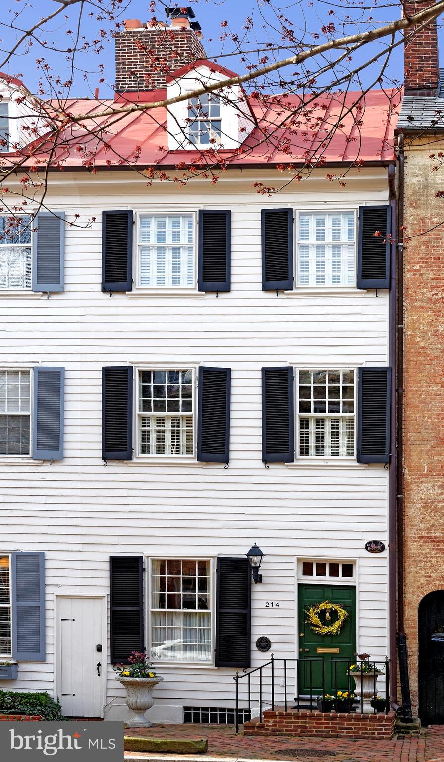 Offers to be reviewed on Monday, April 4th at noon.

Gorgeous Historic Gem on Prized Gentry Row!

Historic home lovers seeking the charm of original features mixed with luxurious elements for modern living will adore this one-of-a-kind jewel on coveted Gentry Row! Built in 1788 and beautifully restored, renovated and expanded, 214 Prince Street exudes elegance, boasting 4 bedrooms and 3.5 baths, and 3,930 sq ft of living space over 4 stories. 

You’ll be completely enamored upon entering this unique and gracious home, brimming with fabulous features like airy 12’ ceilings, 6 working fireplaces, original heart of pine floors, doors, hardware and transom windows, stunning deep crown molding, paneled molding and wainscoting, archways and exposed brick to name a few. 

The generous living room is divine with gorgeous millwork and 2 fluted columns, brightened by a 12 over 12 window. Ease of entertaining continues in the exquisite paneled dining room enriched by chair rail moldings and concealed built-in storage. The huge eat-in kitchen is finely-appointed for the chef and the heart of the house, illuminated by multiple skylights. A built-in sound system, bar sink with beverage cooler, granite countertops, abundant cabinetry highlighted by top glass fronts with lighting, and suite of Thermador appliances enhance the culinary experience. French doors open to a wonderful flagstone patio for private outdoor enjoyment. Level 1 is completed by a tasteful guest powder.

The 2nd floor adorned with original hallway paneling and antique bell jar lighting is occupied by 2 inviting bedrooms, sharing a full bath with claw foot soaking tub and oversized seamless glass shower with hand wand and rainfall shower head. The primary bedroom has crown molding, fluted column accents, a fireplace, built-in bookshelves and 2 big closets. The 2nd bedroom with exposed beams and plantation shutters offers French doors that open to the covered Trex porch with a fan, Edison lights, and stairway to the lower patio. Large antique flower urns convey with the sale, and an irrigation system waters all flowers on this upper porch.

Level 3 is occupied by another lovely bedroom presenting a fireplace, abundant closets, a sitting room, and full bath with basket-weave tile flooring and seamless marble & tile shower. The 4th floor bedroom is a dreamy retreat with vaulted ceilings, 2 skylights, exposed beams, plus a custom built-in wardrobe and storage. Casual living calls on the lower level family room with brick floors, an amazing fireplace, exposed stone walls, and surround sound. There are also numerous closets, additional storage, a front bonus room with a window and built-in shelving, and washer-dryer. 

This enchanting home is truly rare and special, in an unmatched location just 1 block away from shops, restaurants, and the river.