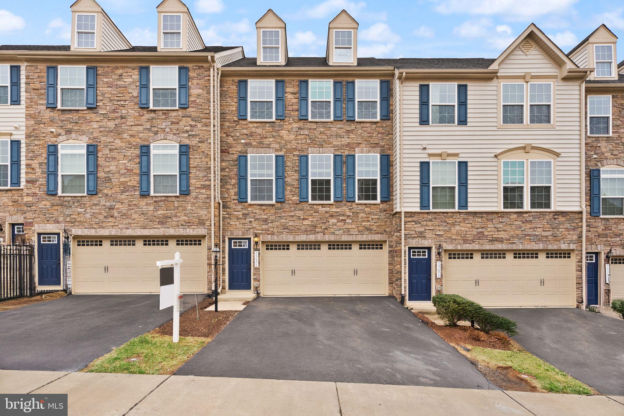 Back on market at no fault of the seller!  Welcome to Wentworth Green!  Nestled in one of Gainesville's most sought after neighborhoods, this 2 car garage townhouse offers the full package and comes with recent upgrades.  Built in 2015, the home shows off an eye-catching stone exterior as soon as you arrive.  Upon entering the main level, you'll quickly notice the open floor plan and how much space there is!  The kitchen features beautiful light cabinets with granite countertops and stainless steel appliances.  It flows into a beautiful main living area with an ideal layout that gets plenty of natural light!  You've also got a lovely dining space with a cute light fixture that steps out onto a fantastic outdoor space.  This home backs to trees for privacy, which you can enjoy sitting on your Trex deck!  Towards the front of the home is a huge space perfect for an office, play room, or more formal dining!  Upstairs you'll find 3 spacious bedrooms, including a picture perfect primary suite. The room features so much space, a beautiful tray ceiling, walk-in closet, and a primary bathroom complete with a double vanity, soaking tub, and standup shower!  Bonus - upstairs laundry, so no lugging clothes up and down the stairs!  The lower level offers a wide-open and very spacious recreation space that walks out to a gorgeous stone patio and private backyard!  You'll also find a magazine worthy full bathroom here with a stunning design.  Recent upgrades include brand new fresh paint throughout (2025), all brand new carpet (2025), basement bathroom buildout (2023), and custom stone patio (2023).  HOA includes fantastic amenities - swimming pool, clubhouse, playground, basketball and tennis court, and walking trails!  The icing on the cake is the location - you're a quick 5 minute drive to Virginia Gateway, one of PW's premier shopping destinations!  Restaurants, clothing and retail stores, BJ's Wholesale, and more!  And with easy access to I-66 and public transportation, you'll have everything you could need.  This property checks all of the boxes so be sure to come see it for yourself!