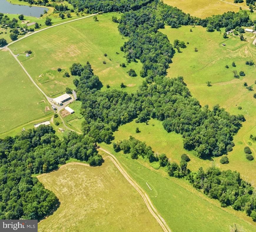 This offering includes 2 tax parcels: Lot 4-T.M.# 5-14 with 154 Acres and multiple large farm buildings and Lot B with a one level 3 bedroom, 2 bath home.  The large farm buildings include a 9 Bay open machine shed (145' x 36"), a second open machine shed (75' x 75'),  a closed work shop with 4 large roller doors (75' x 48'), a cattle barn, 3 grain silos, and 1 cement trench silo. This property is protected by a Conservation Easement which allows a  permanent single family dwelling and a secondary residential dwelling not to exceed 2,500 sq. ft.  of living space. The complete easement can be found in the documents section as well as a plat and description of other adjacent acreage available. For those wanting additional acreage, there is an adjacent 241 acre parcel, also with building rights and in easement, listed separately for $2,170,000.00.  The current T.M.#5-14 is newly assigned to the 154 Acres of this property. Assessed values are not available at this time.