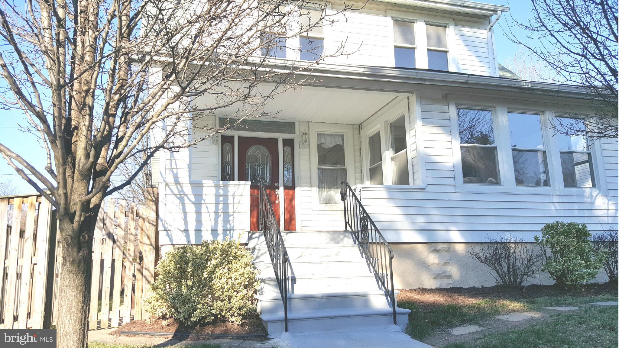 Gorgeous renovated porch-front home with original inlay hardwoods and stained glass plus modern amenities and an open floor plan. Relax in the warmth of your sun room. Have a snack at your granite breakfast bar. Enjoy your spacious finished lower level. Main level laundry room and pantry. Forced air and CAC for year-round comfort. Fenced back yard. Detached garage. Includes 1-year home warranty.