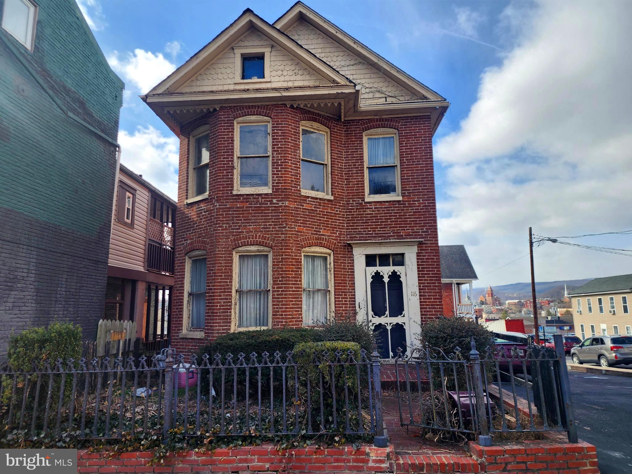 1904 Victorian in the Heart of Downtown Cumberland, step into the charm and potential of this Victorian home, with 3 bedrooms and 2 full bathrooms, this historic property is truly a diamond in the rough and ready for someone to restore it to its former beauty. The main level features: A welcoming foyer, Open-concept living room and formal dining room, Eat-in kitchen, One bedroom and full bathroom. The upper level offers: 2 Bedroms, additional room that could serve as bedroom or a living area for a potential apartment, A small kitchen, Full bathroom.  Additional features include: Walk-up attic with extra storage or expansion potential, Unfinished basement with space for a possible additional finishes, Deck and brick courtyard outdoor.  With some vision, this home could become a beautiful single-family residence or a two-unit investment property.📍 Prime location:  Walking distance to Baltimore Street shops and amenities,Convenient access to I-68⚠️ Property is being sold strictly AS-IS.