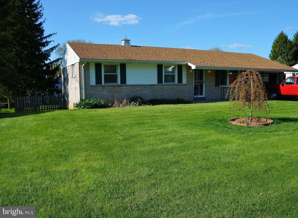 Nice 3 bedroom 1 bath Rancher in quiet neighborhood. Hardwood floors in 3 bedrooms, sunroom with pellet stove and ceiling fan, lower level family room with 1'' slate pool table,large workshop and laundry. Fenced in rear yard with patio and shed.