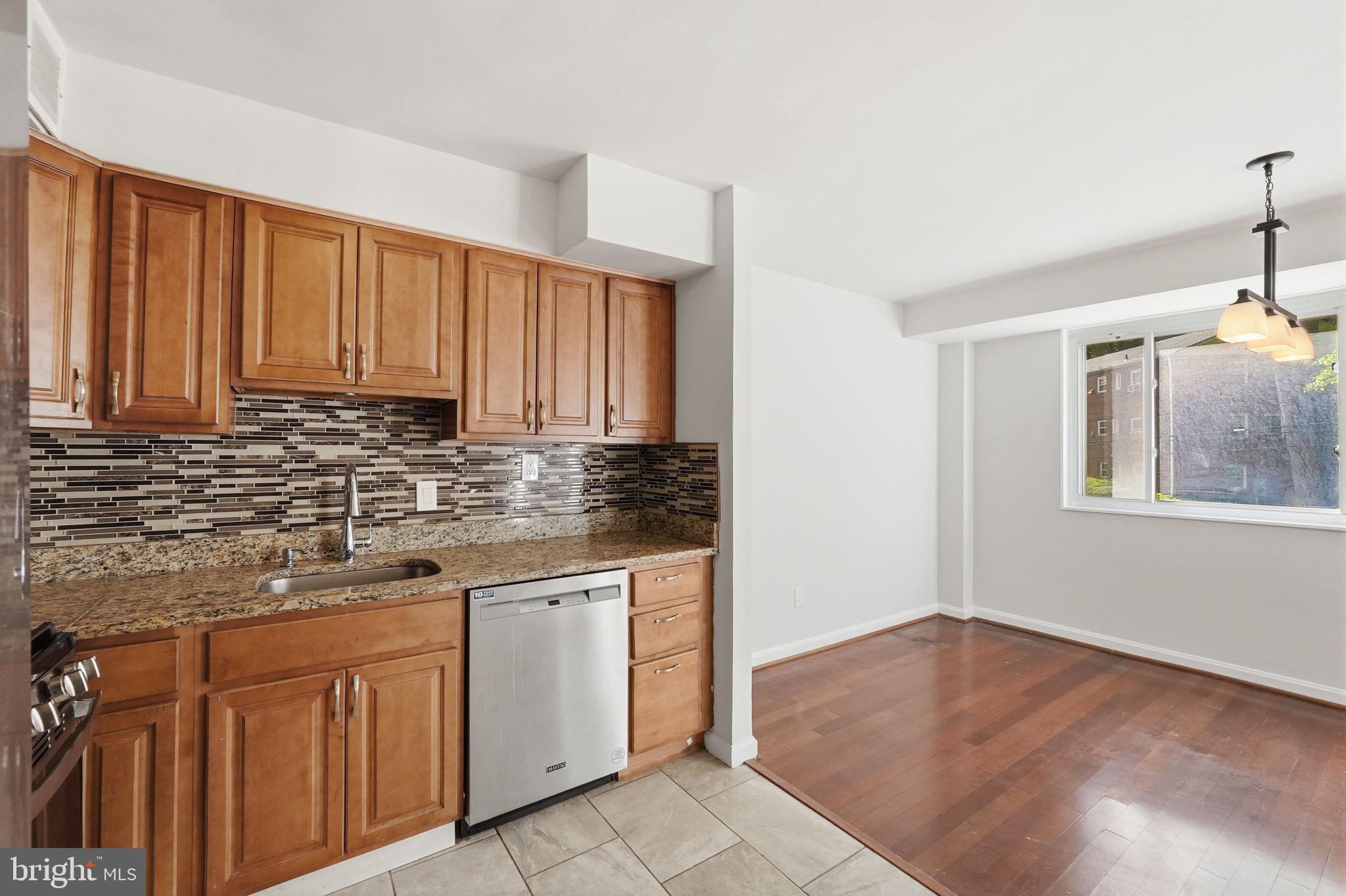 Welcome to the best kept secret in Silver Spring- the best condo value for the lowest price!

Experience easy, low‑maintenance living in this beautifully refreshed 2‑bedroom condo tucked into a quiet, tree‑lined Silver Spring community. Thoughtfully updated with NEW carpet, NEW stainless steel appliances, and NEW interior paint, the home feels bright, clean, and inviting from the moment you step inside.  Featuring real cherry wood floors throughout the main living space, a clear dining space, large windows, and an updated bathroom, you get a comfortable luxury feel without the luxury price.

The garden‑style building offers level entry and convenient access, while the all‑inclusive condo fee covers electricity, gas, water, heat, trash, exterior care, and more—making budgeting simple.

Perfectly positioned next to the upcoming Purple Line station (opening 2027), this location delivers incredible future connectivity. With assigned parking, in‑building laundry and storage, and quick access to shopping, dining, parks, and Downtown Silver Spring, this home blends comfort, convenience, and long‑term value.