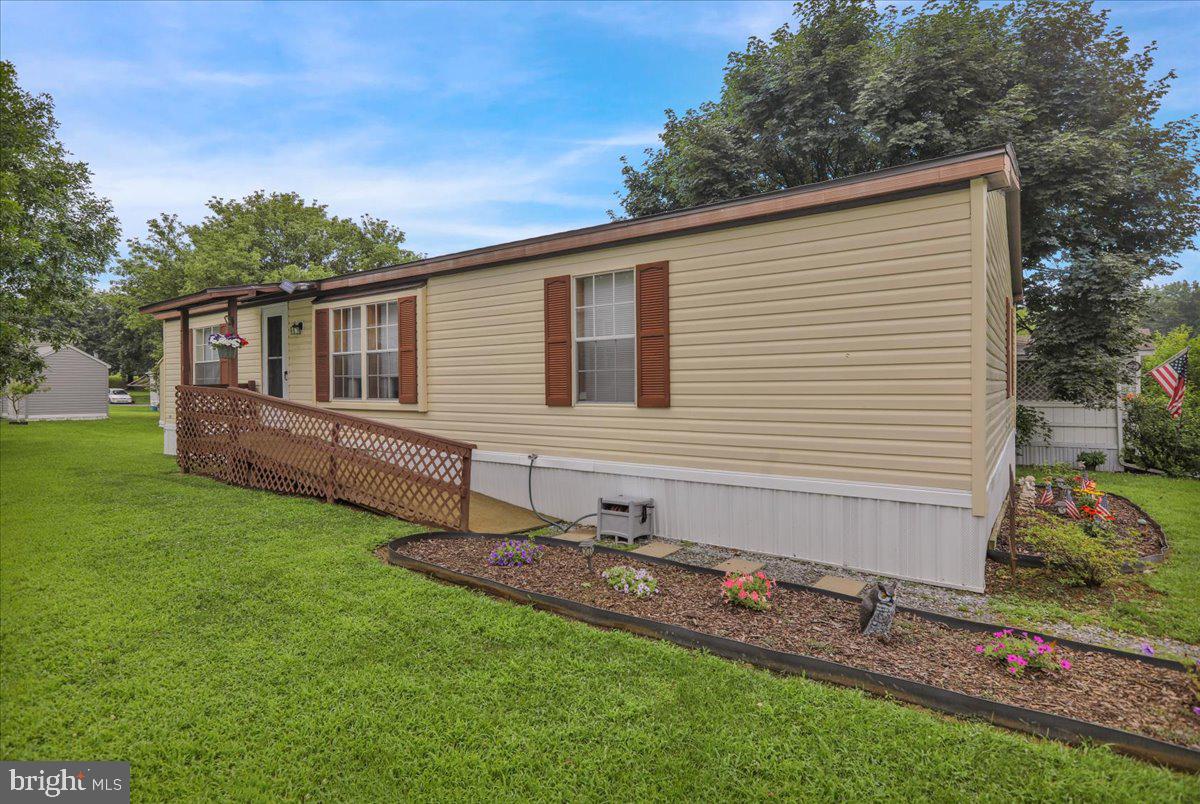 Affordable living at its finest! Looking for easy one-floor living in Northern Berks County?  Come check out 703 1st Street EXT in Hamburg (Tilden Twp.); this move-in ready home offers three good-sized bedrooms, two full bathrooms, open living room, dining room and kitchen area, and a rear deck perfect for enjoying some time outdoors. Very well maintained and many updates, including a new roof (2025), fresh paint and kitchen backsplash (2025), plumbing completely redone (including main, 2023), hot water heater (2022), and HVAC (2016). 
The lot (rented) is easy to maintain and a good sized shed stays with the sale. The lot fee is $670.- ($610 plus $60 sewer cost) and includes water, sewer and trash. Two off-street parking spaces and a ramp to the front door add to your convenience. This mobile home is fully approved with financing available! Schedule your showing and see this 100% turnkey property today!