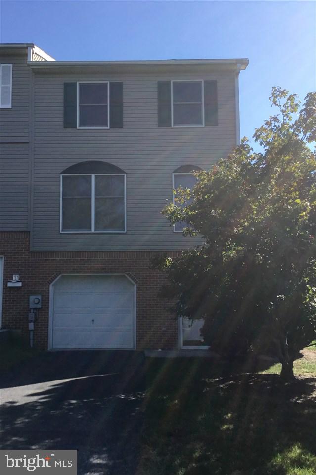 Beautiful end unit townhouse! OfferS 2 bedroom, 1 1/2 baths, kitchen with breakfast bar, all appliances, walk-in pantry, dining area with nice views from the private deck, Living room, Laundry room, slate patio and a 1 car garage! Home has may updates - heat pump, water heater, counter tops, furnace, and AC and much more! Pride of ownership is evident in this "ready to move into" home! ADT Security System and washer and dryer convey! A must see home!