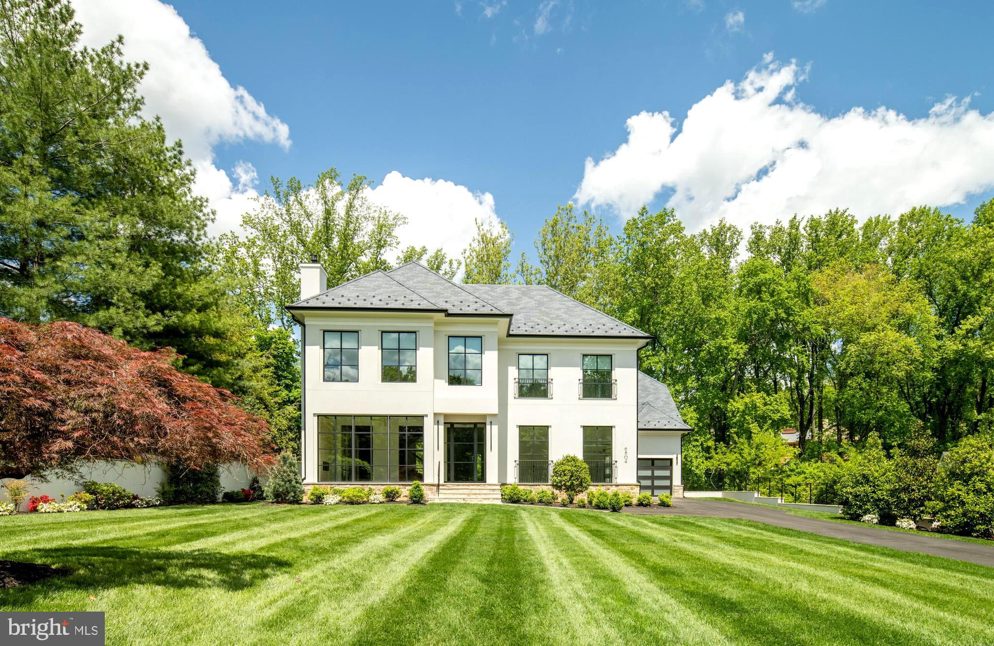 Gorgeous Stucco & Stone Home by Joy Custom Design Build  with  Soaring 11 Foot Ceilings on the Main Level that allow light to stream into  well designed floorplan.  Multiple Outdoor Living Options are available to Fully Enjoy the Peaceful Private Large Lot Backing to Trees.  A Screened Porch with Stone Fireplace and TV is sure to be a Favorite Gathering Spot.  Room for Optional Pool if desired.  Home Features Porcelanosa Baths, Circa Lighting and Bespoke Ceiling Details.    Joy Custom is an Award Winning  Full Custom Builder with  Years of Experience in Estate Homes.   Other Lots Available. Contact us to discuss the possibilities.  Optional Elevator is available.