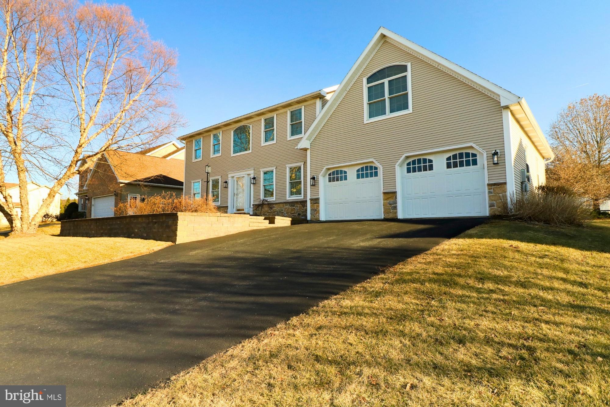 Set your heart on this meticulously maintained 4-bedroom, 3.5-bath home, offering 3,600+ sqft of living space and an oversized 2-car garage in the Westfield neighborhood. This custom-built home showcases craftsmanship and quality in every detail, gleaming hardwood floors throughout, and features central AC and heating for year-round comfort. As you enter, the 2-story foyer exudes an airy and grand atmosphere. The inviting living room features a cozy propane fireplace (controlled via wall switch) with stone surround and wood mantel. French doors lead to a bright sunroom with a vaulted ceiling, skylights, and intricate wood trim, offering abundant natural light and mountain views-ideal for entertaining or relaxing. Glass sliders open to a flat backyard with mature trees and a brick patio for outdoor enjoyment. The kitchen boasts brand-new stainless-steel microwave and range, granite countertops, a center island, custom tile backsplash, natural cherry cabinetry, and double-door pantry. Adjacent to the kitchen is a charming breakfast nook with a bay window that allows light to pour in from the sunroom. Completing the first floor is a lovely dining area, half bath, and laundry room. Upstairs, the primary bedroom suite features a large walk-in closet and a full bathroom with dual sinks, a jacuzzi tub, and a glass shower. Down the hallway, you'll find an additional bedroom and a bonus room, perfect for a hobby, craft space or home office, with a large window, skylights, and an angled ceiling. Two additional bedrooms with hardwood floors and another full bath are also on the second floor. The partially finished lower level offers ample storage space and includes a carpeted family room with custom floor-to-ceiling built-in shelves, an exercise room, and a large full bathroom with a linen closet. Roof replaced 2021, 2 HVAC units replaced (in 2019, and 2022). Situated in a great location close to Naked Egg Cafe and Ferguson Elementary, with quick access to Rt. 45 and College Ave, this beautiful home is not to be missed. Schedule your showing today!