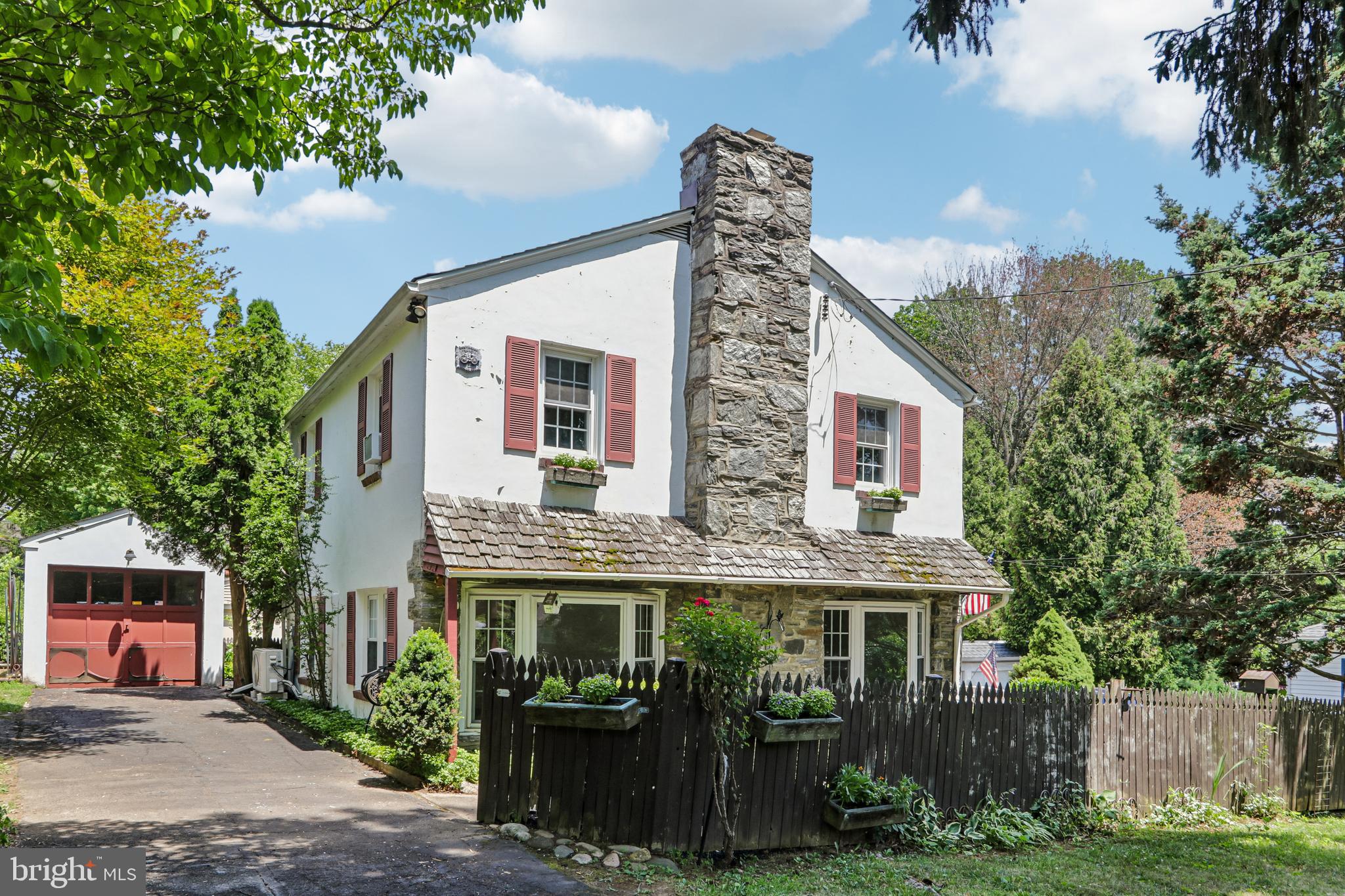 Showings will begin on July 8th.  Welcome to 647 Pinney Road, a charming Colonial in the award-winning Lower Moreland School District, lovingly cared for by the same family since 1968. From the moment you arrive, you'll be captivated by the beautifully landscaped perennial gardens and the home's inviting curb appeal, complete with a charming wooden front fence adorned with window boxes.  Relax in the welcoming three-season room before stepping inside to discover a home that perfectly blends timeless character with thoughtful updates. Gleaming hardwood floors flow throughout the first floor, where abundant natural light pours through newer windows, including two beautiful bay windows overlooking the picturesque front gardens. The inviting stone fireplace with an electric insert creates a cozy focal point in the living room, while the split-system air conditioner keeps the first floor comfortable even on the hottest summer days. Recessed lighting and a convenient first-floor coat closet add to the home's functionality.  The bright kitchen offers newer white cabinetry, a Bosch gas stove, a ceiling fan, and easy access to the wraparound deck that extends from the front of the home to the backyard—creating the perfect space for relaxing or entertaining outdoors. The formal dining room features chair rail molding and an overhead light, making it ideal for everyday meals and special occasions.  Upstairs you'll find three comfortable bedrooms with generous closet space and a beautifully updated full bathroom complete with a mirrored medicine cabinet.  Additional features include a full basement with laundry, a half bath, workshop area, detached garage, and a backyard storage shed. While the lot is modest in size, it has been thoughtfully designed into a gardener's paradise, offering beauty and charm in every season.  Built in 1958, this lovingly maintained home offers the warmth and character of a classic Colonial with many modern comforts. The property is being sold as-is, presenting a wonderful opportunity for its next owner to appreciate its timeless charm and make it their own. Don't miss this rare opportunity to own a home that has been cherished by the same family for nearly six decades.