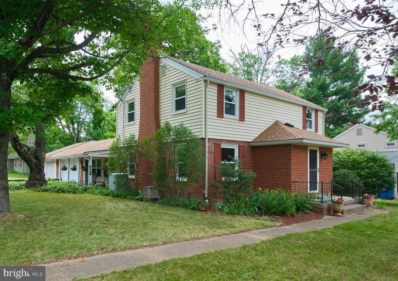 SHOWINGS START FRIDAY.  OPEN HOUSE SATURDAY & SUNDAY 12-2.  Welcome to 451 N Main St in Chalfont Boro!  This lovely 3 BR, 1.5 bath colonial has been lovingly cared for and updated over the years, and is ready for you to move in and start your next chapter!  Entering  the front door, you arrive in a convenient Foyer flanked by coat closet and updated Powder Room.  To the left, a spacious and bright Living Room, featuring brick wood burning fireplace.... perfect for cozy winter nights!   To the right, a modern open Kitchen/Dining Room Combination, with plenty of room for a large dining table for your gatherings of family and friends.  The cheerful updated Kitchen features granite countertops, stainless appliances, and abundant workspace to accommodate multiple chefs preparing your holiday meals.  From the Kitchen, step down into the expansive Family Room featuring wood burning stove and direct walk out to the lovely deck, perfect for alfresco dining on delightful summer evenings.   Upstairs, 3 spacious Bedrooms and a Full Bath complete the picture.  Beautiful Hardwood Floors throughout.  All windows replaced; newer roof, HVAC, & water heater.  ATTACHED THREE CAR GARAGE with abundant storage and workspace perfect for the car enthusiast, hobbyist, or contractor.   Full unfinished dry Basement with Laundry offers lots of space for storage or workshop, or finish for additional living space.  A lovely single home in move-in condition  in the CENTRAL BUCKS SCHOOL DISTRICT at this price is hard to come by.  See it today and make it yours!