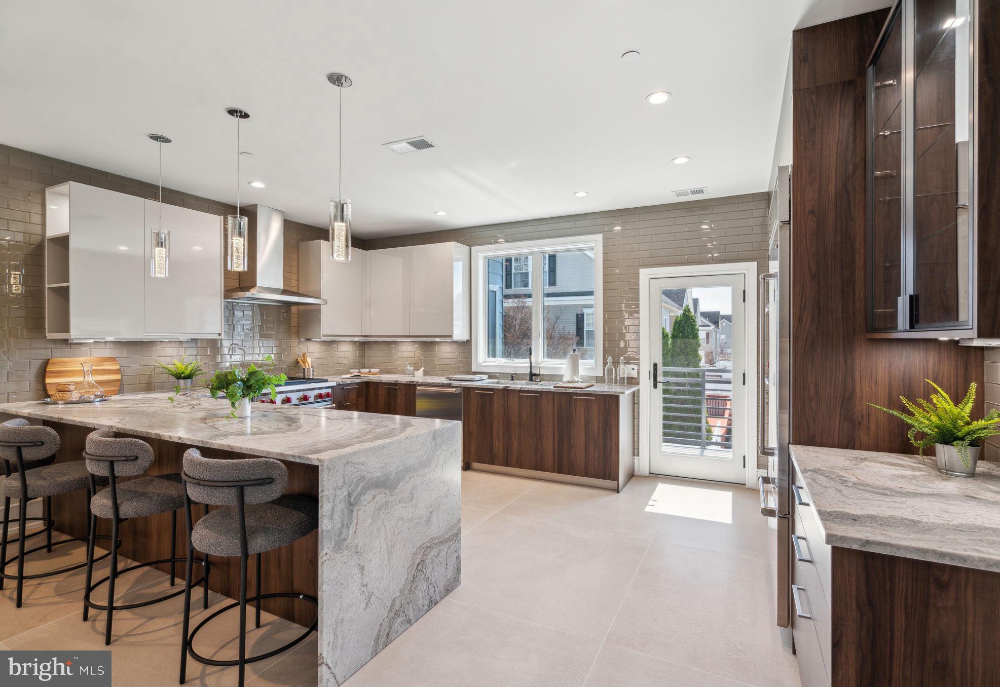 Welcome to 2006 Renaissance Walk, Unit 4—a pinnacle of modern luxury
nestled in Philadelphia’s prestigious Packer Park neighborhood. This newly
constructed townhome exemplifies sophisticated urban living, offering an
expansive 3,200 square feet of meticulously crafted space.
Property Overview:
    •    Price: $1,255,000
    •    Bedrooms: 3
    •    Bathrooms: 3 Full, 1 Half
    •    Square Footage: 3,200 sq ft
    •    Year Built: 2024
Exceptional Features:
    •    Gourmet Kitchen: The culinary heart of this home is adorned with
European-imported Porcelanosa cabinetry, complemented by premium granite
countertops. State-of-the-art appliances, including a Sub-Zero refrigerator and
Wolf range, appealing to the most discerning chefs.  
    •    Elevated Living Experience: A private 4 person, five-stop elevator
ensures effortless access across all levels, enhancing both convenience and
accessibility.  Each level of living is adorned with Porcelanosa tile, french oak
hardwood flooring, custom closets by Closet Works, recessed LED lights, Dual
Zone HVAC, Anderson 440 Series windows, Navien tankless water heater, water
pressure booster pump and much, much more.
    •    Luxurious Primary Suite: The expansive primary bedroom serves as a
serene retreat, featuring a spa-inspired en-suite bathroom with Kohler faucets,
Duravit fixtures, a free-standing soaking tub, and an oversized glass-enclosed
shower.
    •    Outdoor Entertaining: Multiple decks, including a rooftop oasis, offer
panoramic views of Philadelphia’s skyline, providing idyllic settings for relaxation
and social gatherings.
    •    Smart Home Integration: Advanced smart home technology seamlessly
controls lighting, security systems, and climate settings, ensuring a modern and
secure living environment.
    •    Parking: A spacious two-car garage provides secure, off-street parking
with direct access to the residence, with ample extra space for extra storage 
Community and Location:
Renaissance Estates is an exclusive enclave of 14 custom townhomes, with only five homes still available.   Packer Park is a highly desirable, safe, community.  Residents enjoy proximity to lush green spaces like FDR Park, the vibrant Sports Complex, and Live! Casino, offering a dynamic blend of leisure and entertainment options.  
Convenient access to major thoroughfares, including I-95 and the Walt Whitman Bridge and within 7 Minutes of International Airport.   Packer Park ensures effortless connectivity to the broader Philadelphia area and beyond. Experience unparalleled luxury and modern living at 2006 Renaissance Walk,
Unit 4—a residence that truly embodies the essence of a sophisticated urban lifestyle.