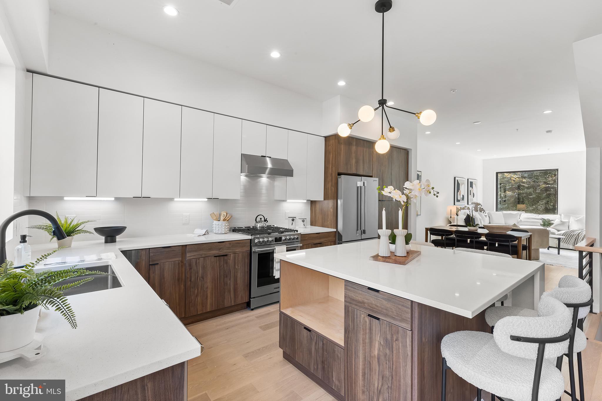 Phase One is gone, Phase Two has begun! Still time to select your kitchen finishes! Welcome to Delmar MNYK, an 8 home new construction development offering 2 car parking, 10 year tax abatements, jaw dropping city views that sit above beautiful landscape, and UNRIVALED OUTDOOR SPACE! A LARGE commonly shared green space is the crowned jewel of this development. Spanning almost the size of the plot the homes sit on, the potential uses are endless. These 4 Bedroom, 3.5 Bathroom beauties are sleekly designed, offering modern, high-end finishes and multiple outdoor spaces, including; a unique front yard and a roof deck. The main level is stunning. Walk in and find white oak floors that are sun soaked by natural light. A large window with a picture-esque view stands as the back drop to your spacious living room. Behind your living room is plenty of space for a dining room table that then leads into your modern, luxurious kitchen. Flat panel, two tone cabinetry, Frigidaire Professional appliances, quartz countertops and a functional square island will bring your inner chef out. Through the door in the kitchen you will find your front yard, landscaped with a tree and pavers, perfect for a bbq. Upstairs you will find two large bedrooms, two full baths (one being en-suite) and a spacious laundry room. On the third floor is the stunning Primary Suite. A single floor all to yourself. The city skykine view overtop of greenery is the back drop of your bedroom that also has extra space for seating. A generously sized walk through closet leads the way to a spa-like, Primary bathroom where a free standing soaking tub is centered in a large window shedding amazing light throughout the day. Above the Primary is a beverage fridge right before you head out to your private roof deck that provides arguably the most serene views in Philly. All the way downstairs, you will find a vestibule upon entering (after parking you car) with a mud area and coat closet. A private 4th bedroom is situated just off to your left, with a bathroom, great closet space and plenty of storage space. These homes are located just steps away from Main Street providing the convenience of downtown Manayunk, while also providing beautiful greenery right behind you.