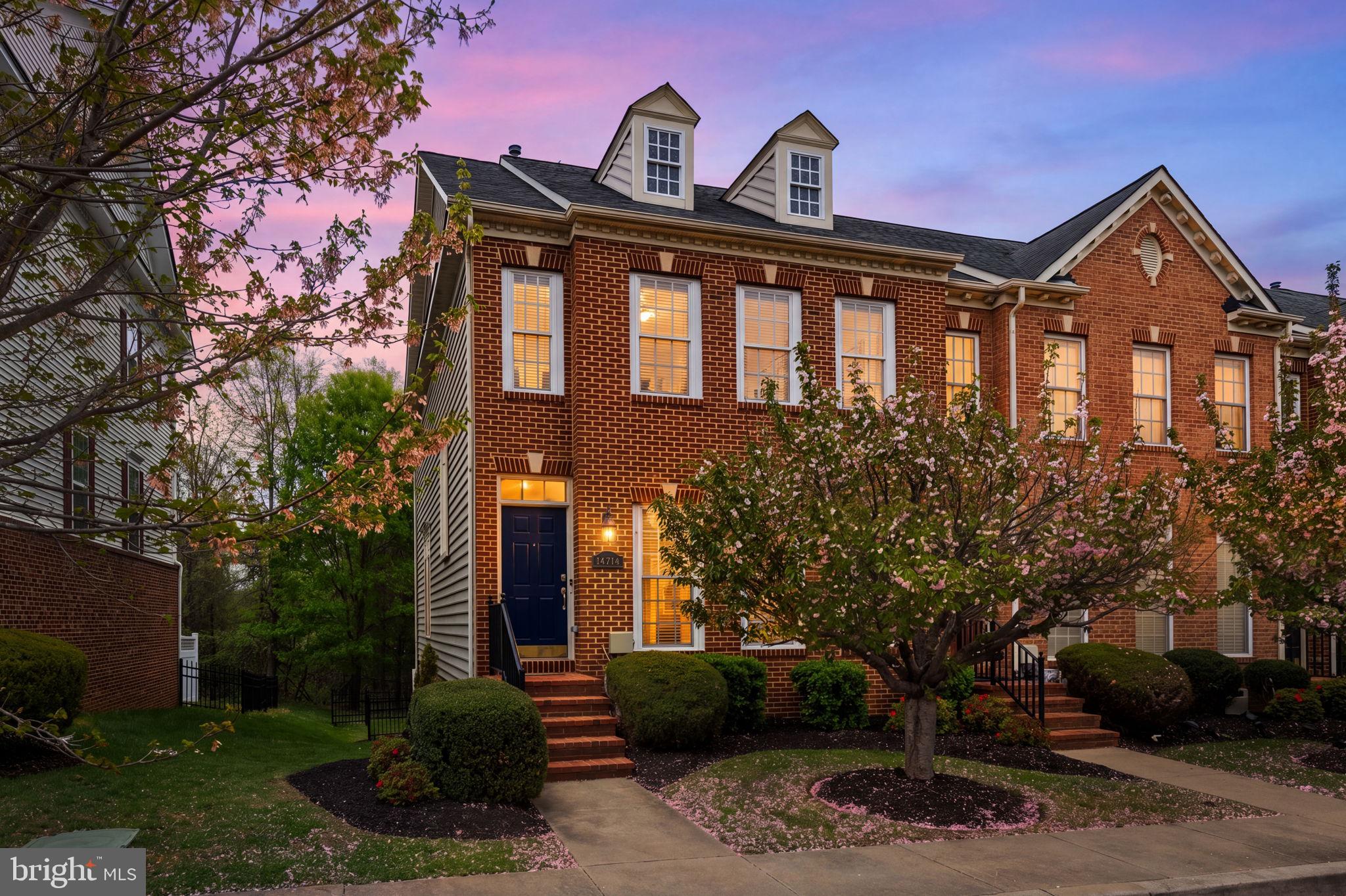 Luxury brick-front end-unit townhome in Oak Creek Club, a premier gated, 24-hour security-guarded golf course community. Offering over 3,000 sq ft—larger than some nearby single-family homes—this residence combines scale, light, and functionality.

Main Level: Welcoming foyer opens to living and dining areas with hardwood floors throughout. Gourmet eat-in kitchen features granite island, 42” cabinetry, stainless steel appliances, double oven, and flows into a sunroom filled with floor-to-ceiling windows. Step onto the composite deck with lighting and privacy wall—ideal for seamless indoor-outdoor living. Powder room included.

Upper Level: Expansive primary suite with abundant natural light, oversized sitting area, and walk-in closet. Spa-inspired bath offers soaking tub, expanded walk-in shower with dual heads (including rain shower), double vanity, and private water closet. TV in shower conveys.

Lower Level: Open recreation space perfect for entertaining or gaming, plus a full bedroom and bathroom for guests. Dedicated storage room and front-load washer and dryer.

Gated backyard. Two assigned parking spaces (#55 & #56) directly in front, plus additional guest parking. HVAC (May 2007) and 48-gallon natural gas water heater (Nov 2023).

Enjoy resort-style amenities including golf, on-site dining, pool, tennis courts, scenic trails, fitness center, and community center—all within a secure, gated setting.