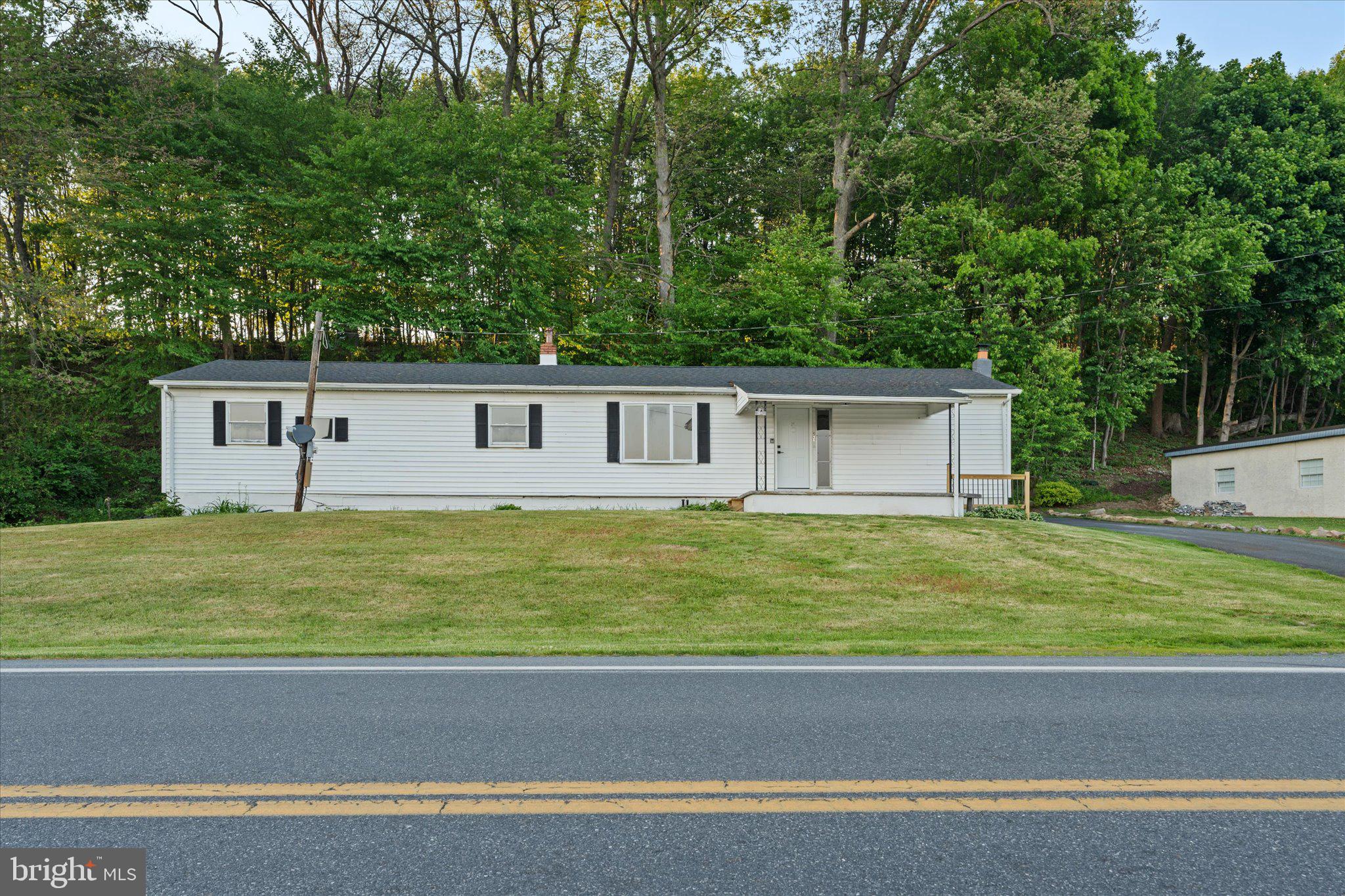 Welcome to 831 Deturksville Rd, a beautifully updated ranch-style home offering modern finishes, spacious living areas, and peaceful rural views. This home features 4 bedrooms, 2 full bathrooms, updated flooring throughout, fresh neutral paint, recessed lighting, and bright, clean interior finishes. The kitchen has been updated with white shaker-style cabinetry, stainless steel appliances, modern countertops, and ample cabinet space. Both bathrooms have been refreshed, including one with a tiled tub surround and another with a stand-up shower.

The home also offers a large basement, providing additional storage and utility access. Outside, enjoy a covered front porch, paved driveway, side patio area, and open views across the road. Conveniently located in the Pine Grove area while still offering a quieter rural setting.

Schedule your showing today and see what this move-in-ready home has to offer.