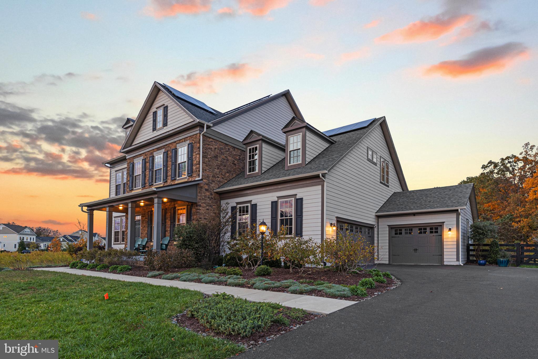 Open house Sat and Sunday OCT 28 and 29. Welcome to a remarkable home nestled in the award-winning Willowsford community! This expansive 6,070 sq ft residence with 5 bedrooms, 5 full baths, and 1 half bath, ensuring there's plenty of room for everyone. Two features really make this home stand out. First, there's a main-level bedroom with its own bathroom – super handy for guests or as a mother-in-law/au pair suite. The second cool thing? It has fully paid-off solar panels, resulting in a net electricity cost of $0 per month!  

As you step through the front door, you will see a formal sitting area offering an elegant space for guests, while to your left, a large dining room awaits those memorable dinner parties.

Journey further into the home, and the stunning living area unveils itself. This space boasts high coffer ceilings that emphasize grandeur, and at its heart, a breathtaking stone-surrounded burning fireplace  – encapsulating both warmth and luxury.

Adjacent to this, the kitchen dazzles with its functionality and style. Every detail has been thought of, making it a chef's dream.

The upstairs journey is equally enchanting. A large window above the staircase pours in natural light, opening up the area and drawing your attention upwards. Here, the primary bedroom does not disappoint. It promises serenity with its vaulted ceilings and spacious design.

Descending to the basement, entertainment possibilities are endless. Whether you envisage a movie room area or a dedicated workout space, it's all achievable in this expansive area.

But the allure of this estate doesn't end indoors. Heading outside, the backyard promises moments of awe. Whether it’s the meticulously designed stone patio, the enclosed fence guaranteeing privacy, or the striking stone fireplace standing as the yard's centerpiece – it's all set against a backdrop of lush trees, making it the perfect setting for hosting friends and family. 

The home comes with a spacious 3-car garage and features electric vehicle chargers, making sustainable living effortless!

Beyond the house, Willowsford opens up a world of unparalleled amenities. From two clubhouses, fitness centers, and resort-style pools to embracing a farm-to-table lifestyle with state-of-the-art facilities – the list is endless. With proximity to shopping, dining, entertainment, and award-winning schools, it strikes the perfect balance between luxury and convenience.

In sum, this Willowsford estate is where charm, luxury, and sustainability intertwine. A visit is a must to truly appreciate its splendor. Seize this golden opportunity to make it your sanctuary!