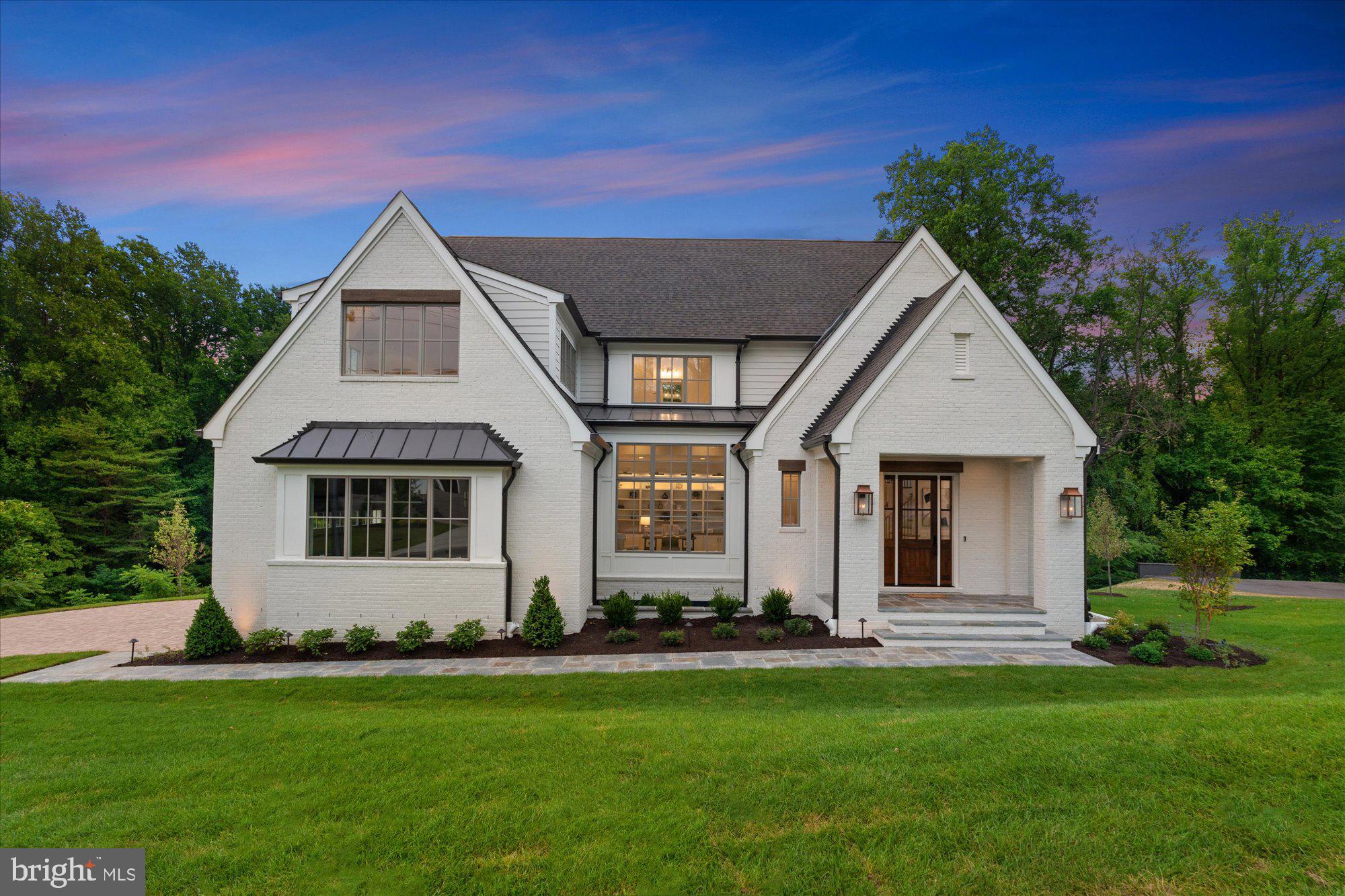 Discover this stunning custom-built home by MR Custom Homes, offering 7,070 sq ft of luxurious living space on a beautifully landscaped 16,058 sq ft lot beautifully backing up to Zachary Taylor Park. The home's exterior is an exquisite blend of brick and Hardi-plank, complemented by architectural roof shingles. The property is designed for both beauty and functionality, featuring a flagstone front porch, a paver driveway, spacious side-load garage with epoxy flooring and EV charging port, and a large rear screen porch with Trex decking and electric heaters. The professionally landscaped grounds include a sprinkler system and extensive exterior lighting, ensuring the home is as stunning by night as it is by day.
Inside, enjoy 10' ceilings on the basement and first floors, 9' ceilings on the second floor, and 8' ceilings in the loft. The main level includes a family room with exposed beams, a gourmet kitchen with a large island, a butler pantry, a library, and a dining room. The custom-designed kitchen features top-of-the-line appliances, including a Wolf gas range, Sub-Zero refrigerator, and Asko dishwasher, as well as a butler's pantry with an additional beverage fridge and ice maker. Don’t miss the entertainer’s dream feature; a pass through window from the kitchen to the screen porch!
The second floor boasts a primary suite with two walk-in closets and a luxurious bathroom, along with three secondary bedrooms, each with its own ensuite bath and walk-in closet. The loft offers an office or optional sixth bedroom with a full bath and it’s own thermostat!
The finished walk-out basement features a bedroom, full bathroom, exercise room, and a large rec room with a fireplace and a swanky wet bar with a full wall of glass enclosed wine storage. Energy-efficient amenities include a ProLine XE 75-gallon gas water heater, a 2-zone Carrier HVAC system, and Andersen 400 Series windows. 
Additional features include 400 amp service, upgraded lighting fixtures, CAT6/RG6 wiring, ceiling-mounted speakers, and custom-built closet shelving. This home also comes with a comprehensive warranty and quality assurance program, ensuring peace of mind.
