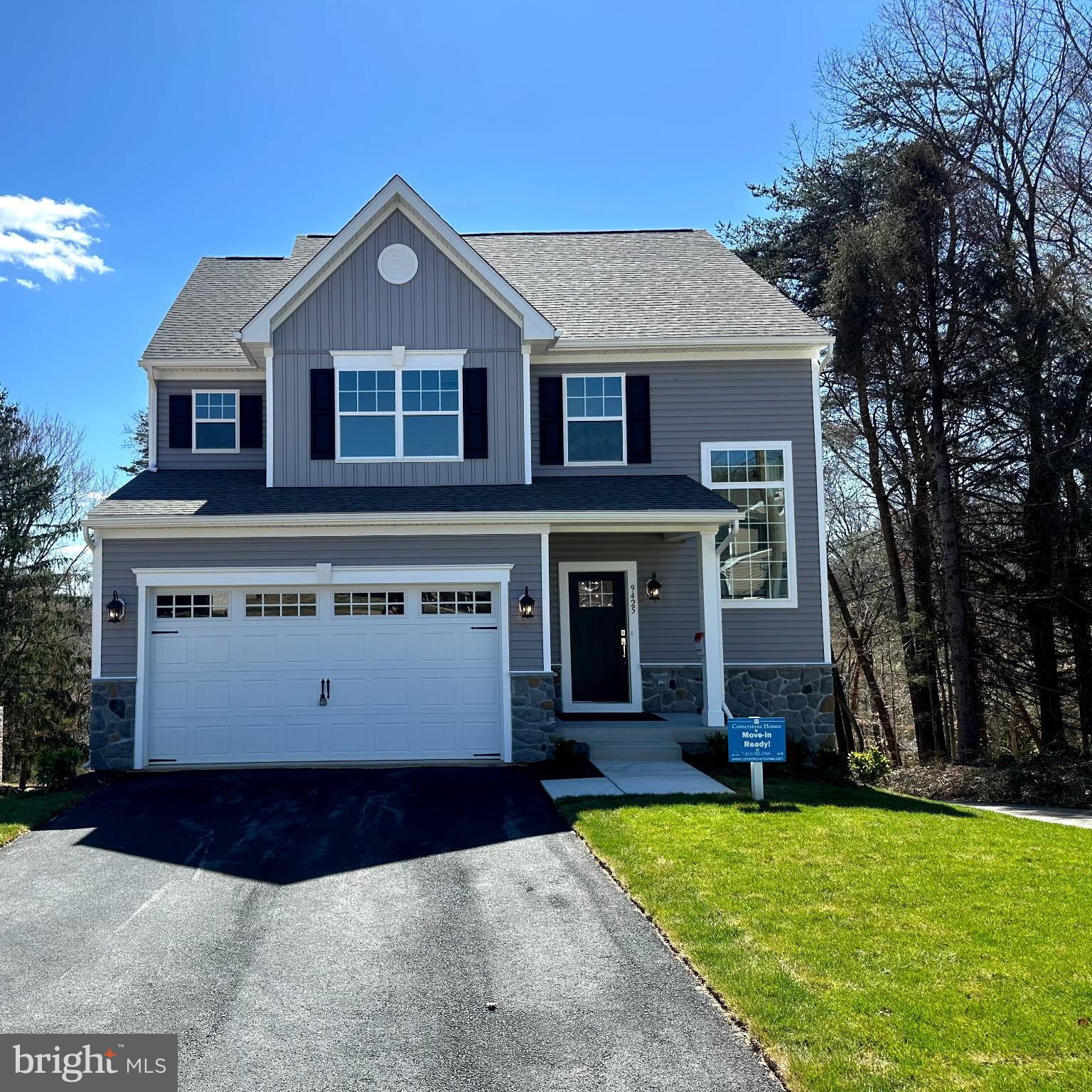 3.99% interest rate for the first year if you use our preferred lender. In addition the builder is offering $30,000 cash contribution towards allowable closing costs for purchaser. Model home is complete and available for quick settlement. This is your chance to buy a model home and be living in your brand new home in 30 days or less! Other homes are also available to be built in Section II of Fairview Woods in Southern Howard County with lots bordering parkland. You can choose from 2 different floor plans the Highland or the Claremont. Fairview Woods is Cornerstone Homes' newest development featuring single family homes with 2 car garages and 3 finished levels of living space. Minutes to major Rts I95, 32, or MARC lines. Convenient to FT MEADE/NSA, JHUAPL and BWI. A short distance to Laurel, Burtonsville, Columbia or Maple Lawn for shopping and restaurants. This wonderful enclave of new homesites are located at the end of Fairview Avenue; backing to Howard County Parks & Rec protected land with views of the Patuxent River! Walking distance to High Ridge Park with trails, tennis, pickleball, tot lot and other rec facilities. Model home features 5 Bedroom 3.5 Bath craftsman with 2 car garage. Dreamy kitchen with walk-in pantry, large breakfast island, soft close, painted wood cabinets with Quartz countertops. A full complement of SS appliances with designer Hood Vent (vented to outside). This popular Claremont model home has a light and airy floor plan with extra-large windows added throughout and plenty of recessed lighting.
Modern design with special features include board and batten accent siding, partial stone exterior, with a covered front porch and a Trex deck with white vinyl rails. Inside the builder included a finished lower level with 9' ceilings, a 5th bedroom, a 3rd full bath and a true walk-out slider to the rear yard. Additional Features worth noting are the premium trim package
(Main Stairwell, Great Room and Flex Room) and the designer vanity cabinet in the first-floor powder room. All the flooring is upgraded; including LVP throughout the main level and stairs up, upgraded pad in the upper and lower carpeted rooms. Deluxe Tile Package in the baths and a tiled backsplash in the kitchen. Primary suite with huge walk in closet, cathedral ceiling and windows with a beautiful wooded view. The En-Suite Bath features a luxurious tiled shower with glass doors, double vanities and a double door linen closet in the bathroom. Upper level laundry room is a wonderful convenience Spacious 2 car garage from a paved driveway with room for 4 more cars. Electric rough in for EV cars is included. Contact builder for more details. Private tours available or stop by the open house on Saturday and Sunday 12-2pm. NOTE: Some photos are of the model with virtual staging.