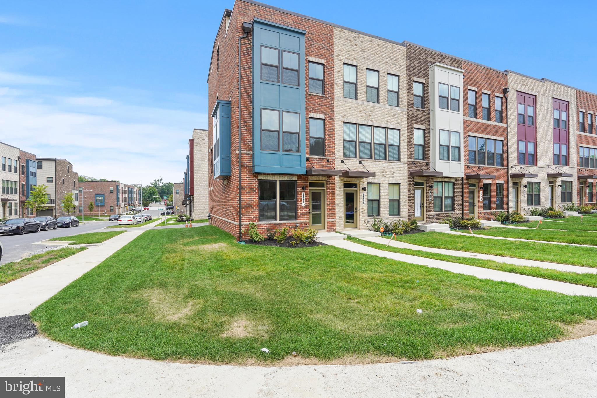 Welcome to your new home! Built in 2021, this stunning and spacious four level, 4 bedroom and 5 bathroom sun kissed End Unit corner townhouse epitomizes the urban living lifestyle. Strategically located next to DC, walking distance to Metro, transit and shopping, and Federal Government Buildings, this End Unit corner town house boasts new stainless steel appliances in a chef inspired kitchen, extensive natural light and four bedroom suites with attached full bathrooms including a bedroom and full bathroom on the ground level.  This house has Bay Windows providing extra sunlight, a deck next to the dining area on the 2nd floor and also a private roof top terrace on the 4th floor perfect for entertaining and relaxation. This house features a bedroom suite on the ground floor that offers privacy and space for ideal for multi generational living and guests alike. This house boasts two bedroom suites with attached bathrooms on the third level. The 4th floor/penthouse of this home also features a private bedroom suite with attached full bathroom and a lounge area perfect for HOME OFFICE with serene ROOFTOP TERRACE VIEWS of this Young and VIBRANT community.  This penthouse floor suite is also perfect for a teenager/young adult who needs their private space. This is one of the newest built homes in the community with one of the largest corner lots. 

The house is freshly painted and contains Brand NEW stainless steel appliances, NEW carpet, Brand NEW ceiling fans, and granite countertops. The garage is freshly painted and features gorgeous NEW premium flooring. No need for a lawn mover as the HOA is responsible all exterior grounds maintenance here. This Vibrant Community contains multiple kids play areas, has jogging/walking paths, and dog park. The HOA also provides Wi-Fi/Internet. This house has two separate cooling and heating systems that maximize comfort and efficiency. All the air vents including the dryer vent have been professionally cleaned/sanitized and the house is ready to welcome its new owner! 

This house is strategically located inside the Beltway, steps from the Suitland Metro station, buses, and the community is across the street from the Suitland Federal Center (which houses the US Census Bureau, Navy and DHS offices) and less than 2 miles from DC. Joint Base Andrews, the USCIS headquarters, shopping, Tesla/EV charging stations, Tanger Outlet Mall, National Harbor and major highways are also within close proximity. 

If you're looking for a strategically located lovely modern townhouse in Maryland with an open layout, new appliances, new carpeting, in close proximity to Washington DC, with plenty of space, a private roof top terrace, bathrooms on all levels with lots of natural light, and access to public transportation, this is a must see! Don't miss this golden opportunity before its too late. Come visit your new home and become part of this new vibrant community!