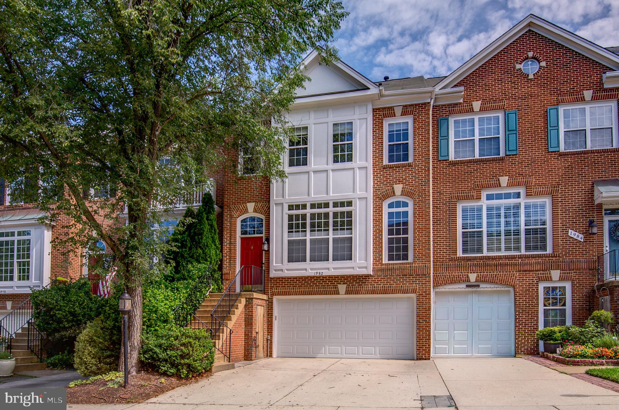 Nestled in the highly sought-after West Market community, just moments from Reston Town Center, this beautifully updated townhome offers the perfect blend of luxury, convenience, and modern living. Thoughtfully renovated throughout, the home features new engineered hardwood flooring on the main and upper levels, creating a sophisticated and cohesive design from the moment you enter.

The dramatic living room is filled with natural light, highlighted by soaring ceilings and expansive floor-to-ceiling windows that create an airy, inviting atmosphere. At the heart of the home, the updated kitchen showcases quartz countertops, refreshed cabinetry, modern appliances, and generous prep and storage space. Just off the kitchen, a spacious deck provides the perfect setting for outdoor dining, entertaining, or simply enjoying peaceful views of the surrounding community.

Upstairs, the luxurious primary suite serves as a private retreat, offering ample space, comfort, and a beautifully updated en-suite bath. Additional bathrooms throughout the home have been tastefully refreshed with quartz countertops, updated cabinetry, and modern fixtures. New hardware and designer finishes throughout further enhance the home's turnkey appeal.

The walkout lower level offers exceptional flexibility with a cozy gas fireplace, creating the perfect space for a recreation room, home office, gym, or guest retreat. The HVAC and Hot Water Heater has been recently replaced. An oversized two-car garage provides abundant storage and everyday convenience.

Residents of West Market enjoy access to an impressive array of community amenities, including a swimming pool, fitness center, clubhouse, and scenic trails. Ideally located near Reston Town Center, Metro access, major commuter routes, shopping, dining, and entertainment, this exceptional residence offers a rare opportunity to enjoy one of Reston's most desirable lifestyles.