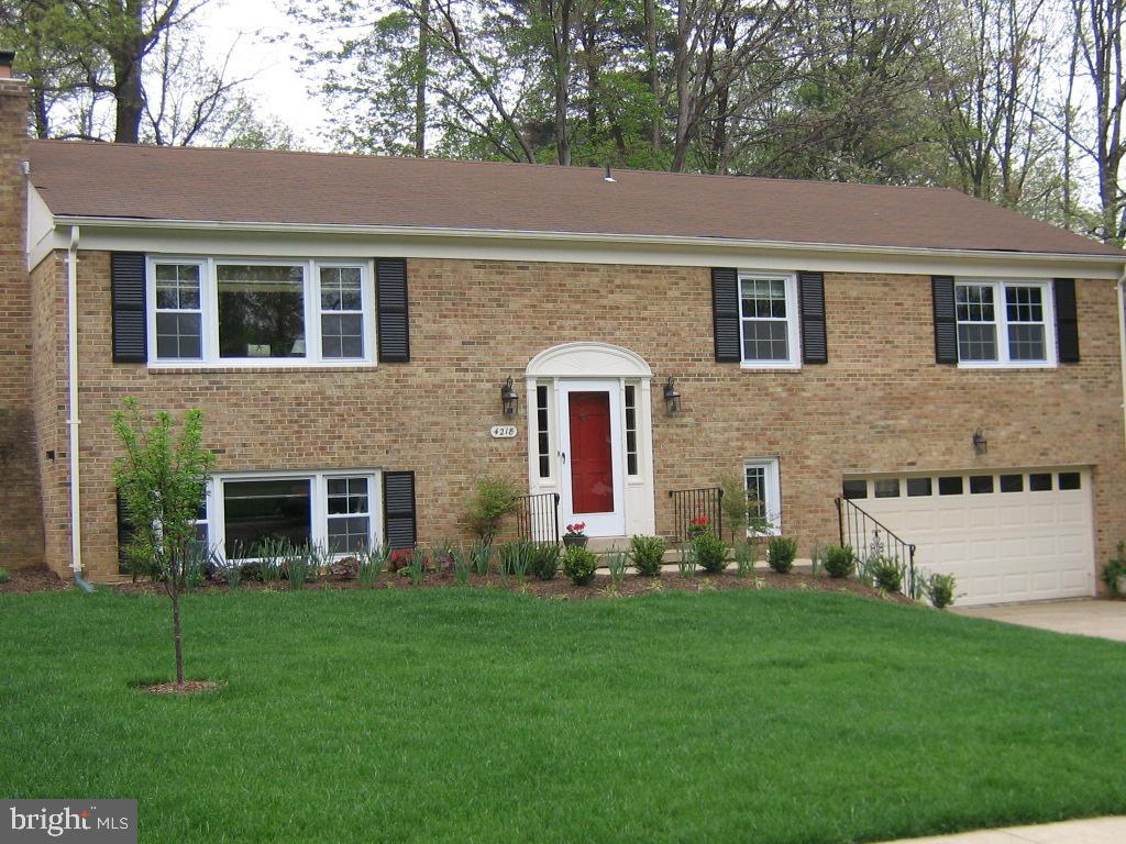 Beautiful large split foyer home with double car garage and quarter acre lot!  Hardwood floors throughout main level. The home has a large updated kitchen and separate dining room - with french doors out to a very large screened in porch and deck. New hot tub! Upper level has 3 bedrooms and 2 full baths. Bedrooms are all great sizes and have built ins in all the closets. The kitchen is large enough to have a table or add an island. Lower level has an ensuite bedroom (#4) with a walk-in closet, a large laundry room with extra built-in cabinets, workspace and laundry tub. The family room is in the lower level and has new carpeting, wood burning fireplace, and a large picture window for lots of light. Great hang out area, home office, arts and craft space (half the family room is carpeted, half has vinyl).   The garage entrance is in the lower level too. The backyard is fully fenced and has a shed.  Recent updates include windows, roof, hvac, refrigerator, carpeting and new hot tub. Community is near Highland Park Pool, Huntington Metro and Telegraph Rd access of the beltway, as well as Old Town Alexandria  and Franconia District Park nearby! Close to Fort Belvoir, Pentagon, Andrews and Bolling AFB