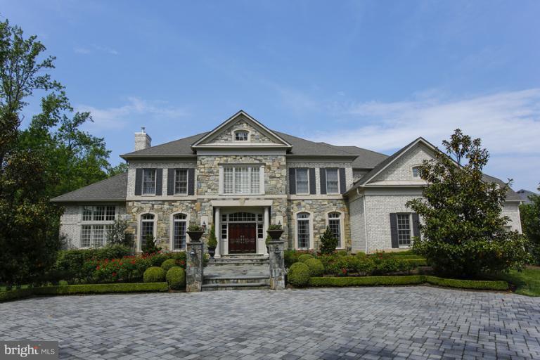 Spectacular Gulick Colonial on just under 2 acres.  Upgrades and custom finishes on all 3 levels including an amazing resort like backyard with pool, spa, fireplace and patio.  Very spacious 5 bedrooms on upper level and a bonus room with full bath over 4 car-garage.  Walk-out Lower level with Recreation Room, walk-behind Wet Bar, Media Room, Game Room, Den. Special Custom hardscape and landscape!