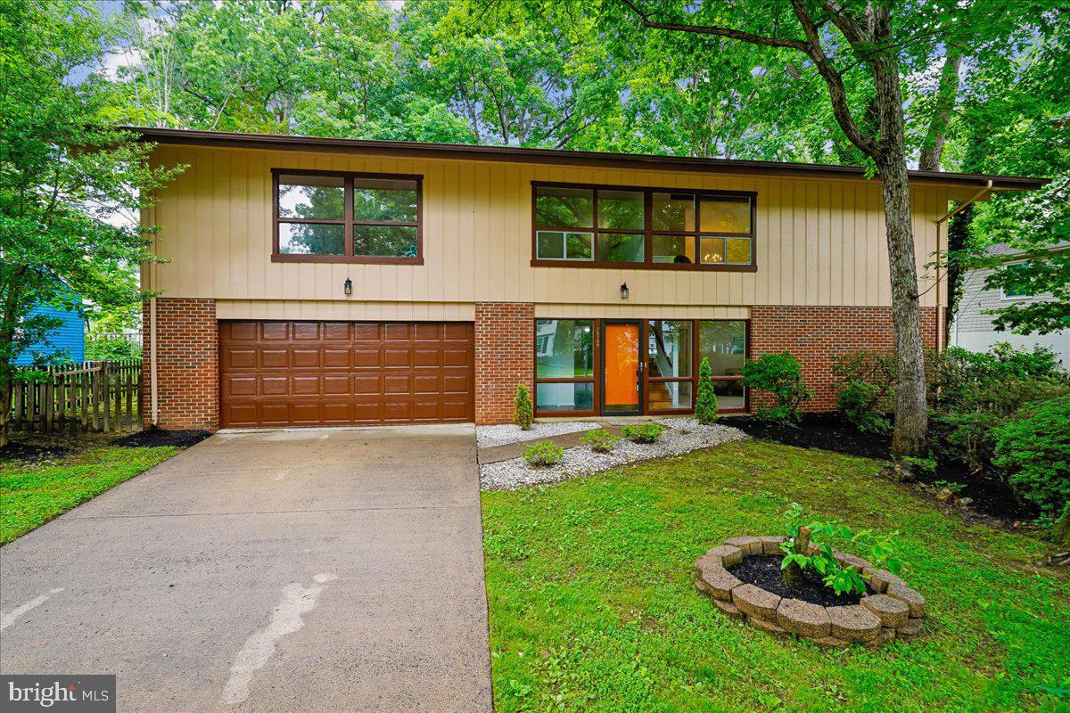 Rare contemporary style meets fresh modern updates in sought-after Lake Montclair! Set on a fully level lot, 15739 Vista Drive stands out from the moment you arrive with oversized windows, crisp clean lines, and architectural character that is hard to find. Step inside the slate-style foyer and immediately feel the cool contemporary vibe. Hardwood stairs lead to the main living spaces, while the entry level offers incredible flexibility with a large front living room that is perfect for work or play, and a spacious bedroom featuring direct patio and backyard access, a fully refreshed dual-entry full bath with quartz-topped vanity and new fixtures, and a laundry room for convenience, Enjoy direct acces to oversized two-car garage from the foyer.
Upstairs, the wow factor continues with soaring vaulted ceilings, exposed beams, and a dramatic A-frame wall of windows flooding the home with natural light. The expansive living and dining spaces are made for entertaining, relaxing, and everyday living. The kitchen has been beautifully updated with brand new onyx granite countertops and a stainless steel appliance suite including a new low-profile microwave. Step out onto the deck overlooking the backyard and enjoy the easy indoor-outdoor flow.
Down the hall, all bedrooms feature fresh new carpet, while the primary suite has received a stunning glow-up with a spa-inspired bath showcasing oversized soft-toned tile, a seamless walk-in shower, quartz-topped vanity, and all new fixtures designed to melt the stress away. The additional bedrooms share a fully refreshed third bath with stylish new finishes throughout.
Freshly updated, architecturally unique, and packed with personality, this special Montclair home delivers incredible value with the big ticket items all done including the Roof (2017), HVAC (2019) and Water Heater (2023) in one of the area’s most sought-after communities. Don’t miss your chance to own something truly different... Enjoy all the incredible amenities Montclair has to offer including a 109-acre stocked lake with those sandy beaches, boat ramp, boat storage, fishing piers, playgrounds/tot lots, ball fields, exercise stations, new dog park, 18-hole golf course with full-service Country Club, ...the list goes on! Easy access to I-95 and nearby commuter lots/buses make it easy to commute to DC, the Pentagon, and beyond. Home is currently enrolled in a premium home warranty with the option to transfer to buyer at closing. BONUS, this is a Project My Home Approved Listing. Qualified buyers may be eligible for a fixed interest rate as low as 4.99% through the seller’s preferred lender program. Buyer must qualify and speak directly with lender for full details, program terms, and disclosures. Rate, APR, and program availability subject to borrower qualification and may change without notice.