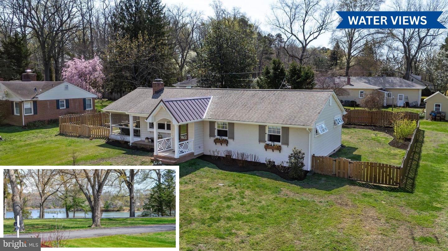 Enjoy easy one-level living in this charming 3-bedroom home located in the highly desirable Oxford Road corridor, offering lovely views of Peachblossom Creek and access to private waterfront lot . Inside, the home features a bright open kitchen with a marble island and huge walk in  pantry. The living room offers a cozy gas  insert fireplace, while the foyer welcomes you with attractive tile flooring. A heated, semi-enclosed porch provides a comfortable space to enjoy the outdoors year-round. The primary suite includes Large walk in closet with built in features.  The  primary bath has  a no-threshold tile shower and custom vanity with double sinks. Additional highlights include a laundry room with washer, dryer, and folding table, a partially floored attic for extra storage, and a new metal roof sections installed in 2025. Fenced rear yard with shed.  A wonderful opportunity to enjoy relaxed Eastern Shore living in a prime location near the water and close to downtown Easton, shopping, YMCA , bike trails, and parks. Excluded :  One peony plants and 2 lilies.