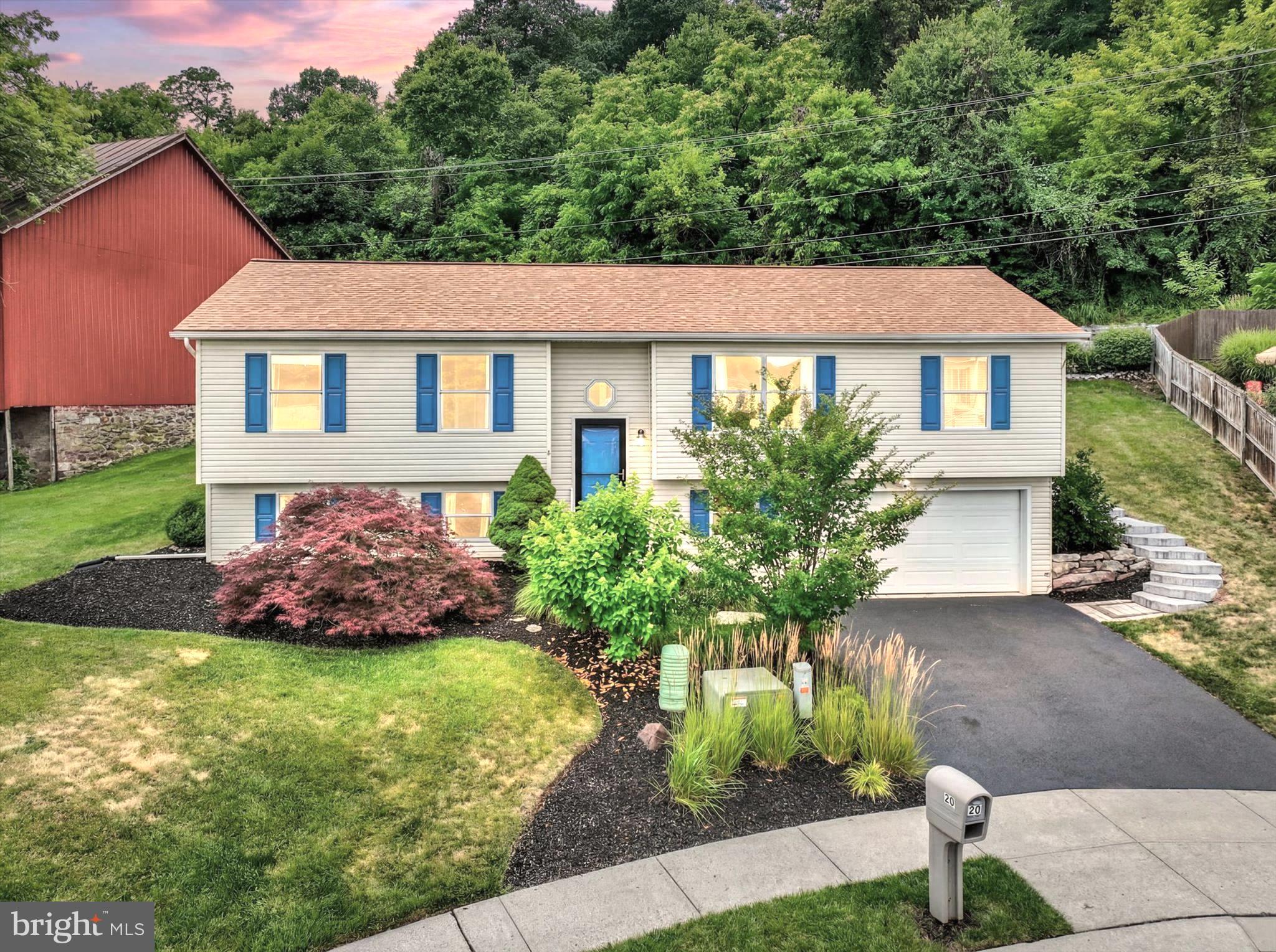 Tucked away on a peaceful cul-de-sac in the desirable Riverview community of York Haven, welcome home to 30 Susquehannock Drive — a beautifully maintained and thoughtfully updated residence offering comfort, flexibility, meaningful improvements, and exceptional outdoor living. With approximately 1,910 square feet, this home delivers the perfect blend of everyday function and relaxed neighborhood living in a setting buyers will immediately appreciate.

From the moment you arrive, the home makes a wonderful first impression with attractive curb appeal, mature landscaping, blue accent shutters, and a charming backdrop. Inside, the main level features a warm and welcoming layout with a comfortable living room, dining area, and an updated eat-in kitchen designed for everyday living and entertaining. The kitchen offers bright cabinetry, granite-style countertops, stainless steel appliances, island seating, recessed lighting, and easy access to the rear entertainment area — perfect for grilling, relaxing, playing in the yard, and hosting friends and family.

The home offers four bedrooms and two full baths, including a spacious primary suite with a walk-in closet and a beautifully renovated primary bath completed in 2023. The primary bath features a double vanity, updated finishes, and a stunning tiled walk-in shower with built-in niches, bench seating, and upgraded fixtures. The additional bedrooms offer excellent flexibility for family, guests, hobbies, fitness, or office space.

The lower level expands the home’s livability with a large recreation room, dedicated office area, storage, utility space, and interior access to the garage. Whether used as a media room, game room, home gym, playroom, or work-from-home retreat, this level provides valuable space to fit a variety of needs.

The outdoor living space is truly a highlight. The rear yard has been thoughtfully enhanced with a custom retaining wall installed in 2020, creating a beautiful and functional setting for multiple outdoor gathering areas. Enjoy evenings under the pergola, relaxing around the fire feature, dining on the deck, gathering around the firepit, or simply enjoying the usable yard space. With patio space, deck space, string lights, a storage shed, and a scenic backyard setting, this property offers the kind of outdoor lifestyle buyers love.

Major updates provide additional peace of mind, including a roof that is only approximately 5 years old, AC and heat pump replaced in 2019, and a water heater that is approximately 6 years old. Conveniently located with easy access to Route 83, York, Harrisburg, Camp Hill, Mechanicsburg, Gettysburg, Maryland, and the PA Turnpike, this home offers a wonderful combination of comfort, updates, outdoor enjoyment, and commuter convenience.

Beautifully cared for, move-in ready, and positioned in one of the most appealing locations within the neighborhood, 30 Susquehannock Drive is the perfect place to feel at home, entertain with ease, and enjoy the comfort of a thoughtfully updated property.