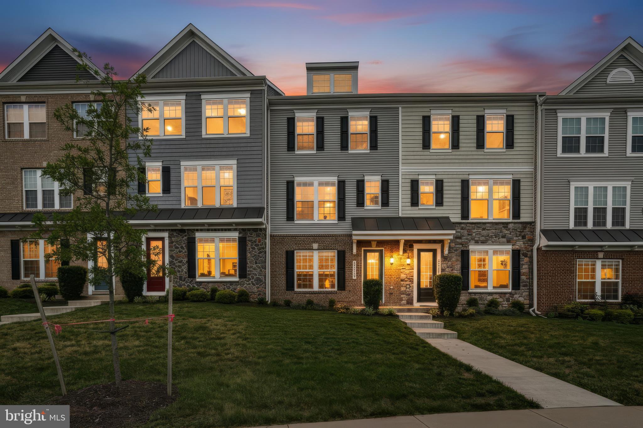 Not every townhome-style condo offers the space, finishes, and garage that buyers have been waiting for—and almost none combine them at this price.

Built in 2020 and beautifully updated, this move-in ready home delivers the modern design today's buyers want without the maintenance that comes with owning a traditional townhome. Unlike many homes in the community, this residence features a true two-car garage, offering the storage and convenience that is increasingly difficult to find.

Inside, nearly every detail feels elevated. The open-concept main level was designed for both everyday living and effortless entertaining, centered around a stunning gourmet kitchen with an oversized island, Carrara quartz countertops, upgraded white cabinetry with soft-close doors and drawers, designer hardware, double wall ovens, stainless steel appliances, and abundant workspace. Luxury vinyl plank flooring flows throughout the main living area while oversized windows fill the home with natural light and lead to a private deck perfect for morning coffee or evening relaxation.

Upstairs, the spacious primary suite serves as a true retreat with a spa-inspired bath featuring a frameless glass shower, marble-look tile, and upgraded cabinetry. Two additional bedrooms, another full bath, recessed lighting throughout, and an upper-level laundry room provide comfort and convenience for everyday living.

Freshly painted and meticulously maintained, this home is completely move-in ready, allowing the next owner to simply unpack and enjoy.

The lifestyle is just as impressive. The condominium association handles exterior maintenance, lawn care, water, trash, snow removal, playgrounds, and more, giving you more time to enjoy everything Haymarket has to offer.

Located just minutes from I-66, you'll enjoy quick access to Wegmans, Sprouts, shopping, restaurants, breweries, wineries, and everyday conveniences. Even more exciting, the nearby Heathcote Marketplace continues to expand with new retailers and restaurants, adding even greater value and convenience to an already exceptional location.

Modern construction. Luxury finishes. A rare two-car garage. Low-maintenance living. Opportunities like this don't come along often.