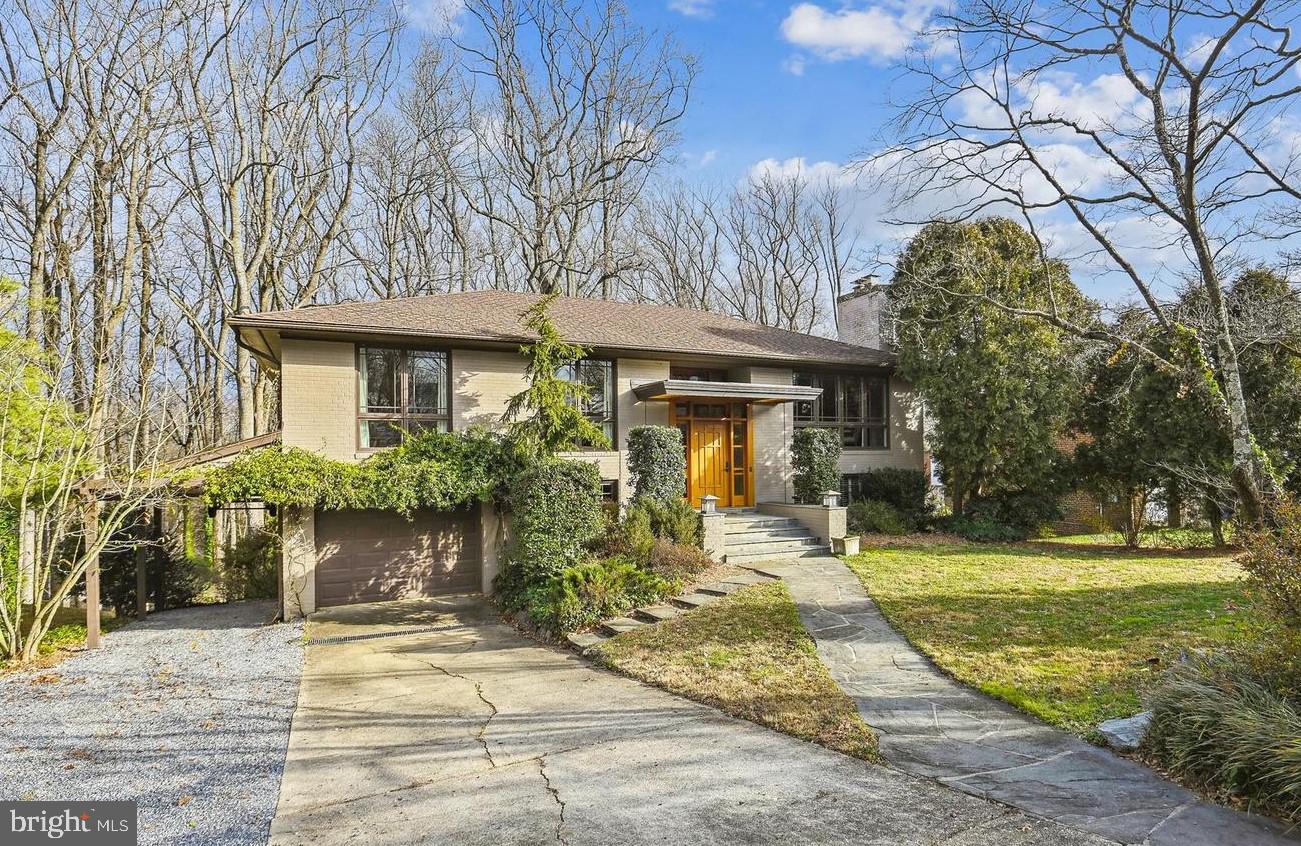 *Discover this *GORGEOUS* 6BR/3BA home nestled within a serene cul-de-sac location in sought-after POTOMAC HILLS!  *FABULOUS* addition/remodel by notable DC architect firm Barnes Vanze.  The custom-designed entrance to the home welcomes you with an exquisite custom-made Sapele wood door that opens to the inviting foyer area with lovely custom railings.  This well-maintained and light-filled home features handsome crown molding, gleaming hardwood floors, custom built-ins and updates to the kitchen addition and front entrance of the home.   The inviting main level includes a spacious living room with gas fireplace and large custom windows that flow into the formal dining area with adjacent hall that leads into the kitchen and breakfast room .  Enter the stunning bright kitchen with top-of-the-line features, including a Wolf gas cook-top, subway tile backsplash and coffered ceiling. The kitchen is open to the breakfast room plus French doors walking out to the deck overlooking beautiful parkland. Retreat to the primary suite on the main level with French doors to deck and ensuite with heated flooring and frameless steam shower. This level has two additional  bedrooms and a full-size bathroom. The lower level features a large family room, two spacious bedrooms, updated bathroom with soaking tub, and huge mud room with custom built-ins and access to the garage.  One more level offers even MORE space to unwind, with a large recreation room that can easily adapt to your needs - whether it’s a home theater or fitness room and an additional spacious room to use as a home office or playroom with walk-out to the backyard. This level includes the laundry room  plus a huge storage room.  A contemporary designed deck with single beam support, allows for natural light to flow into the lower levels of the home.  The large driveway includes an additional gravel parking area. Single garage and carport. Super, sought-after location with access to miles of Pimmit Run trails, minutes to Chain Bridge and GW Parkway, with immediate access to downtown McLean, Arlington, and DC.  Chesterbrook, Longfellow and McLean Schools!