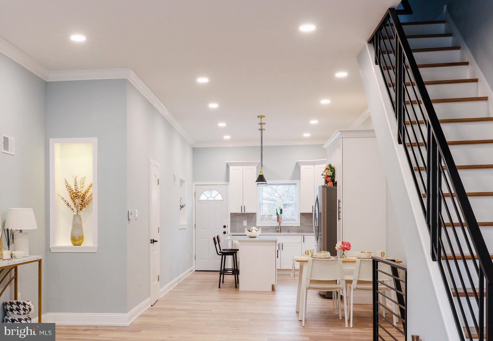 Welcome to 1609 Jackson Street,  a true gem that redefines neighborhood standards with premium upgrades and meticulous renovations—all at an unbeatable price point. This stunning 3-bedroom, 3.5-bathroom home has been thoughtfully transformed from top to bottom, offering an extraordinary living experience that radiates quality and comfort.  
Every inch of this home reflects a commitment to excellence, with new hardwood floors, a brand-new roof, and premium finishes throughout. The open-concept gourmet kitchen is a chef’s dream, featuring custom countertops and sleek lighting, making it perfect for both cooking and entertaining. High ceilings throughout add an unparalleled sense of space and elegance, with nearly 10-foot ceilings on the main floor, creating a grand atmosphere and enhancing natural light.  Each room has been meticulously upgraded with carefully selected finishes, ensuring that this home stands out as truly one-of-a-kind.
Timeless bay windows, elegant crown moldings, and custom details further elevate the ambiance, blending classic charm with a sleek, modern aesthetic. Natural light pours into the bedrooms, creating warm, inviting spaces. The  HVAC system is cleverly concealed within the walls, maintaining clean lines and seamless climate control without any visible ducts—every system has been thoughtfully integrated.
You’ll find that the bathrooms here are designed with both style and function in mind. In the master suite, indulge in a soaking tub and an advanced shower system offering a spa-like experience at home. Smart mirror lighting provides the perfect illumination for makeup application and morning routines. Additionally, a powder room on the main floor offers a practical solution for guest use and everyday convenience
The  almost 8-foot fully finished basement is a standout feature, offering a versatile space perfect for entertainment, a kids' playroom, or whatever your lifestyle demands. This additional space enhances the home’s overall functionality, making it ideal for relaxation and recreation. The basement also includes a full bathroom, adding convenience and versatility. The washer and dryer, along with essential systems, are neatly tucked away, maximizing the space’s usability while maintaining the home’s clean lines and seamless design.
Step outside to your private, fully renovated backyard—an urban oasis perfect for relaxing or entertaining. The property also offers clean and convenient back access via a wide alley, enhancing the ease of urban living. This block is more than just a location—it’s a community. Once you get to know it, you’ll understand why neighbors fall in love with this hidden gem, and you will too. This block features an extra-wide street with no-time-limit parking—an incredible and rare perk that sets it apart from other streets. Plus, you're just steps away from hospitals, public transportation, and all the conveniences of city living, making it an ideal home base. This address boasts a Walk Score of 95 out of 100, making it a Walker's Paradise where daily errands can be easily completed on foot. It offers the best of city living with easy access to parks and green spaces, ensuring a perfect balance of urban convenience and outdoor relaxation. 
This is a masterpiece, where every detail has been crafted to deliver a luxurious experience. It’s a lifestyle designed with love and care, waiting for its next fortunate owner to embrace modern comforts in a vibrant urban setting. With its seamless blend of luxury and convenience, this home offers the very best in city living.
