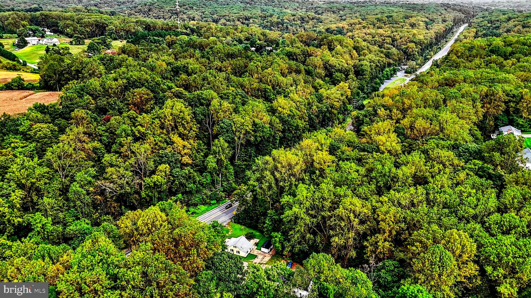 A rare opportunity to own a property that offers both immediate enjoyment and exceptional future potential.

Set along highly visible Belair Road, this unique property combines the comfort of residential living with the flexibility afforded by BL zoning—a combination that is increasingly difficult to find. Whether you're seeking a place to call home, space to support a business venture, or a long-term investment opportunity, this property provides options that can evolve with your needs.

The property is uniquely positioned to provide exceptional accessibility, featuring parking directly in front of the home, a private driveway leading to a detached garage and two-car parking pad, as well as rights to an additional private access drive that offers an alternative entrance and exit point. This rare combination creates convenience for everyday living while also enhancing the property's long-term versatility.

Inside, the home offers a welcoming atmosphere and functional living spaces, while the surrounding grounds provide room to enjoy, expand, and make the property your own. The setting strikes a balance between accessibility and privacy, creating a unique environment that is difficult to replicate.

For those seeking additional room to grow, the adjacent parcel is also available for purchase, further expanding the possibilities. The additional land features a scenic stream and natural surroundings that create a peaceful backdrop and add character to the property.

Conveniently located near shopping, dining, employment centers, and major commuter routes, this property offers a unique blend of residential comfort, business flexibility, and future opportunity.

With BL zoning, multiple access points, ample parking, and the option to acquire additional land, this is a property that can adapt to a variety of needs both today and for years to come. In today's market, it is rare to find a property with such a compelling blend of convenience, flexibility, and long-term potential—all within a highly accessible location.