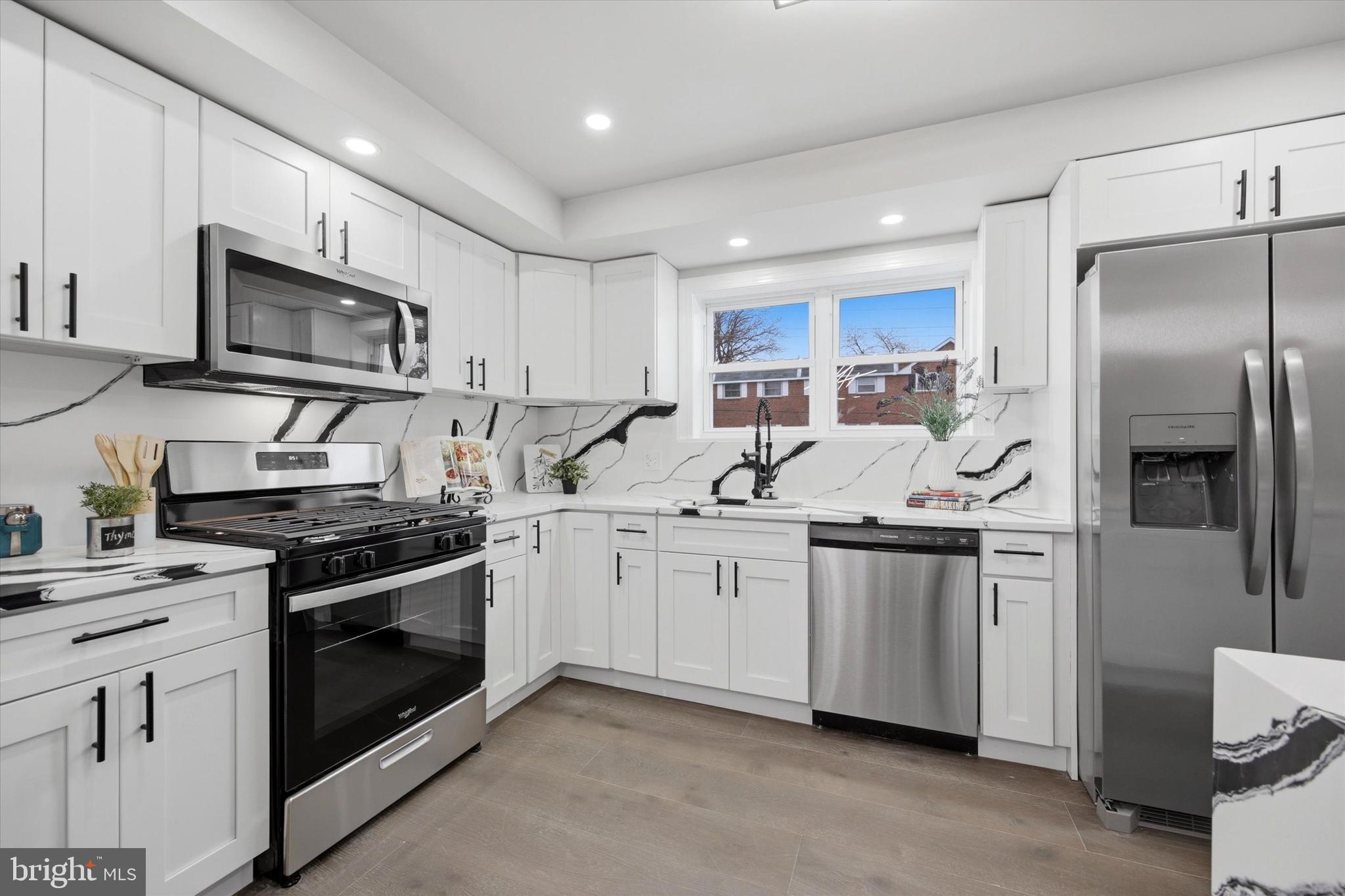 Beautifully renovated from top to bottom, this 3-bedroom, 1.5 bath home at 1519 Forrester Ave is truly move‑in ready. Enjoy a bright open main level with refinished wood floors, recessed lighting, and a stylish dining area that flows into a brand‑new kitchen featuring stylish white cabinets, sleek countertops, stainless steel appliances, and a peninsula for extra seating. Upstairs offers three comfortable bedrooms with great closet space and an updated full bath with modern tile and finishes. The spacious finished basement provides a fantastic bonus area for a family room, office, or gym, along with a convenient half bath and laundry. Outside, you’ll love having both a private driveway for off‑street parking and usable backyard space for relaxing, grilling, or play. Central air, updated electric, new lighting throughout, and a high‑quality renovation make this home an easy choice.