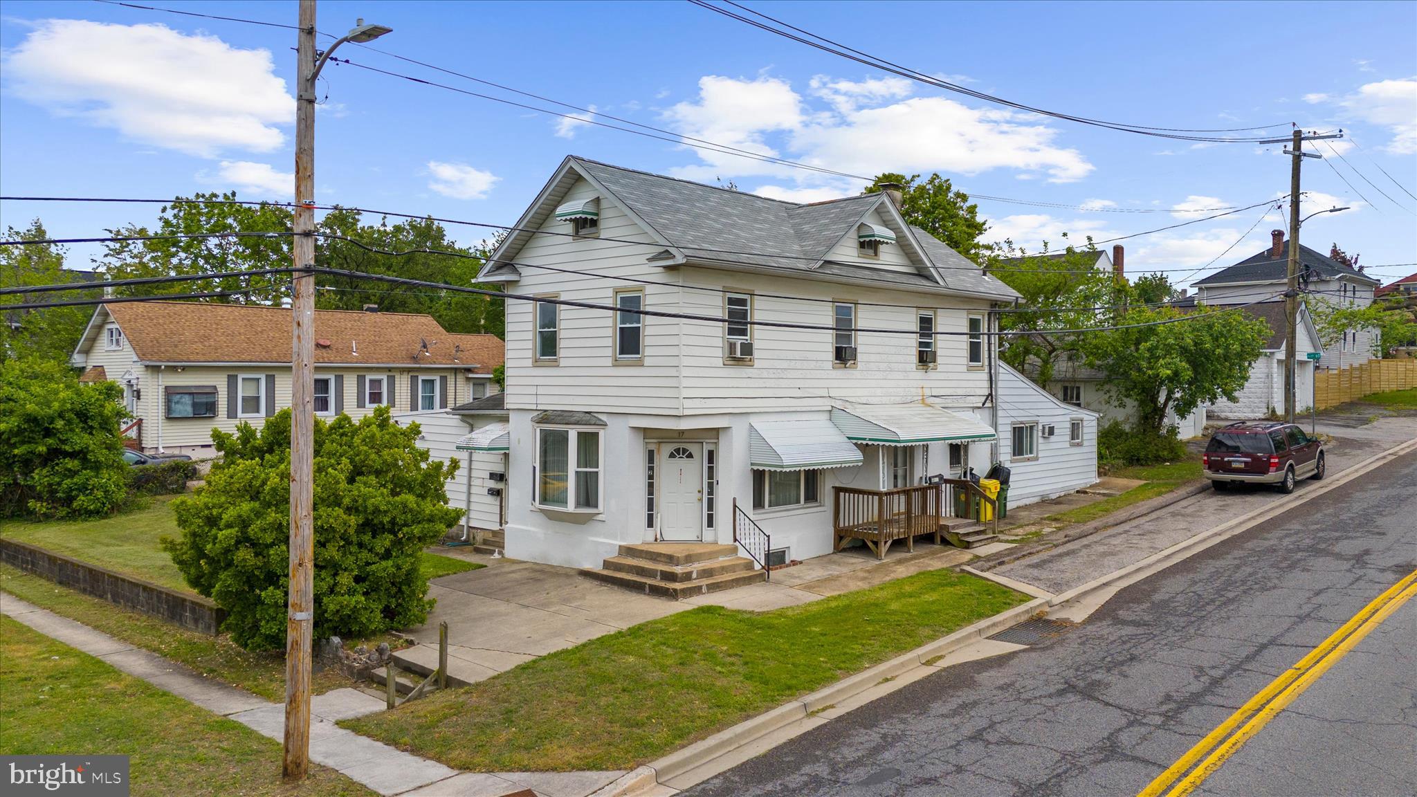 Motivated seller- income producing opportunity! Three separate units, all with individual entrances, as well as one two car detached garage! The upper unit has two bedrooms and one full bathroom with kitchenette as well as a separate washer and dryer. The main unit is larger, also with two bedrooms and one full bathroom. This unit has a large living room with dining room as well as a full kitchen. This unit also has access to a full sized basement, as well as it's own washer and dryer, and access to the yard. The third unit is currently rented, and has one bedroom and one full bathroom. This unit has a kitchen, as well as a porch area that opens to the backyard. There is over 3500sqft of finished space on a large corner lot.