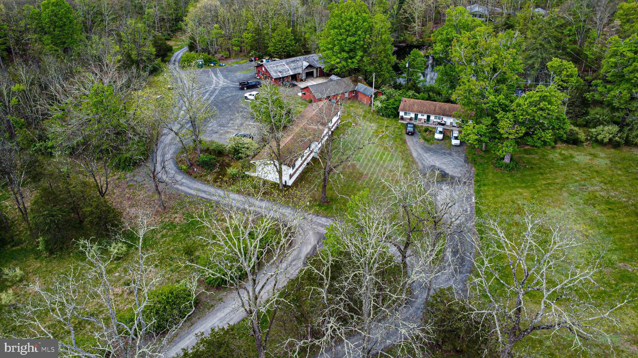 51± Acre Pocono Development Opportunity | Existing Income 

The Pocono Mountains remain one of Pennsylvania's premier tourist destinations, drawing visitors from New York, Philadelphia, and New Jersey seeking outdoor recreation, hospitality experiences, and short-term rental stays just hours from major metro areas. Opportunities of this scale and flexibility are increasingly rare.

Located in Middle Smithfield Township, 174 Sports Camp Rd offers approximately 51.5 acres with existing infrastructure, current rental income, large recreational areas, multiple buildings, and substantial long-term development potential. Formerly operated as the All-Star Resort complex, the property is a rare find for developers, hospitality operators, investors, or visionary buyers looking to acquire a large-scale Pocono property where much of the early groundwork has already begun.

Unlike raw land, this property already includes residential rental units and storage facilities generating income while future plans are explored. Large existing structures, open recreational areas, wooded trails, scenic natural features, and a substantial pond create opportunities for adaptive reuse, event space development, hospitality concepts, short-term rental communities, or phased residential development.

Although there is no builder tie in - Preliminary planning discussions with builders and engineers have already explored the site's potential for residential and hospitality uses. While approvals have not been finalized, a framework for feasibility, subdivision, septic direction, and phased development has already been identified — giving a buyer a head start versus a typical raw land purchase. A builder experienced in barndominium and large-scale residential construction has been involved in early planning and remains available to continue with a future owner.

Located near ski resorts, Bushkill Falls, hiking and nature preserves, casinos, waterparks, and shopping, this property sits within one of the Northeast's strongest tourism-driven markets.

Full Development Opportunity package available upon request.